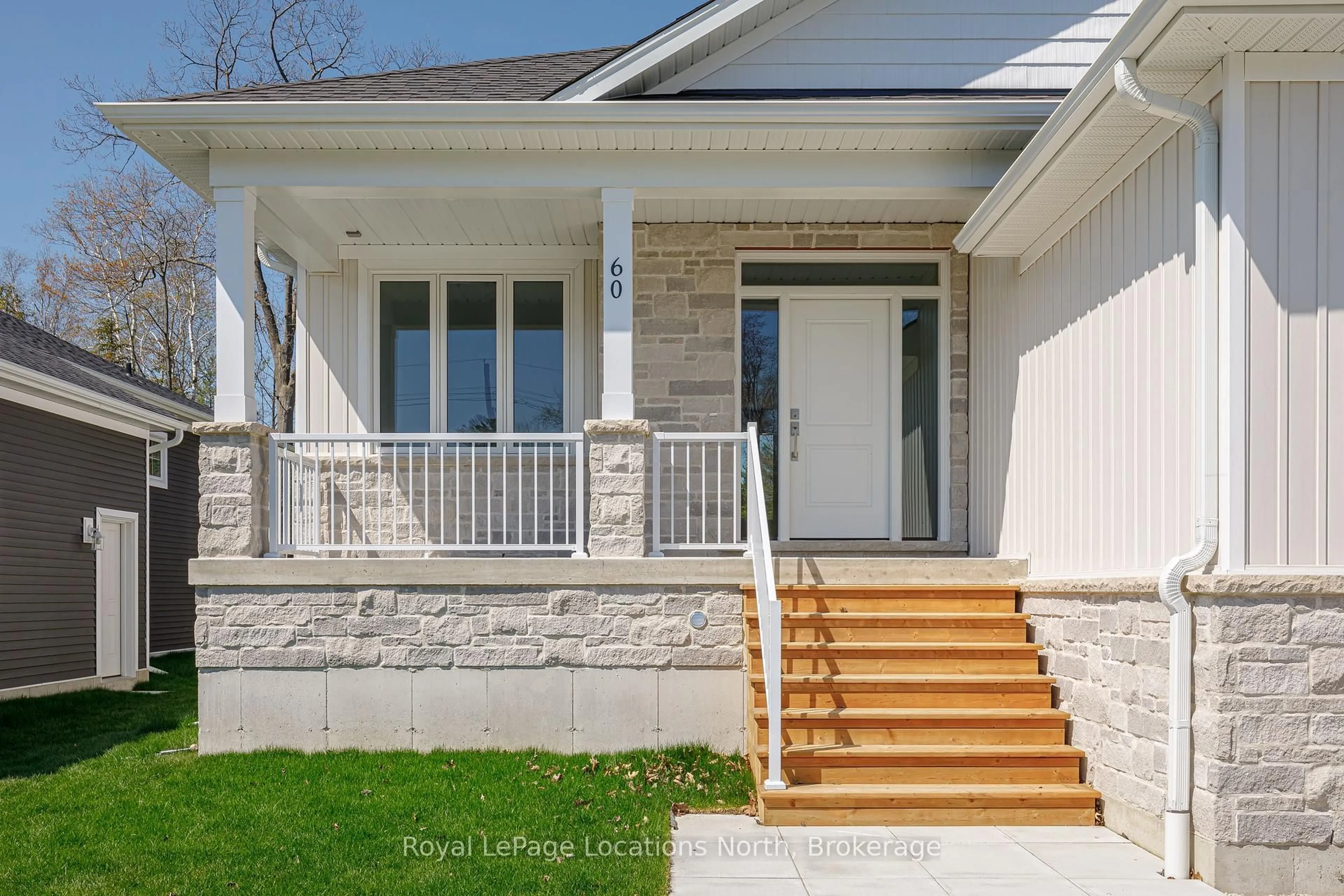 Home with vinyl exterior material, street for 60 52nd St, Wasaga Beach Ontario L0M 1P0