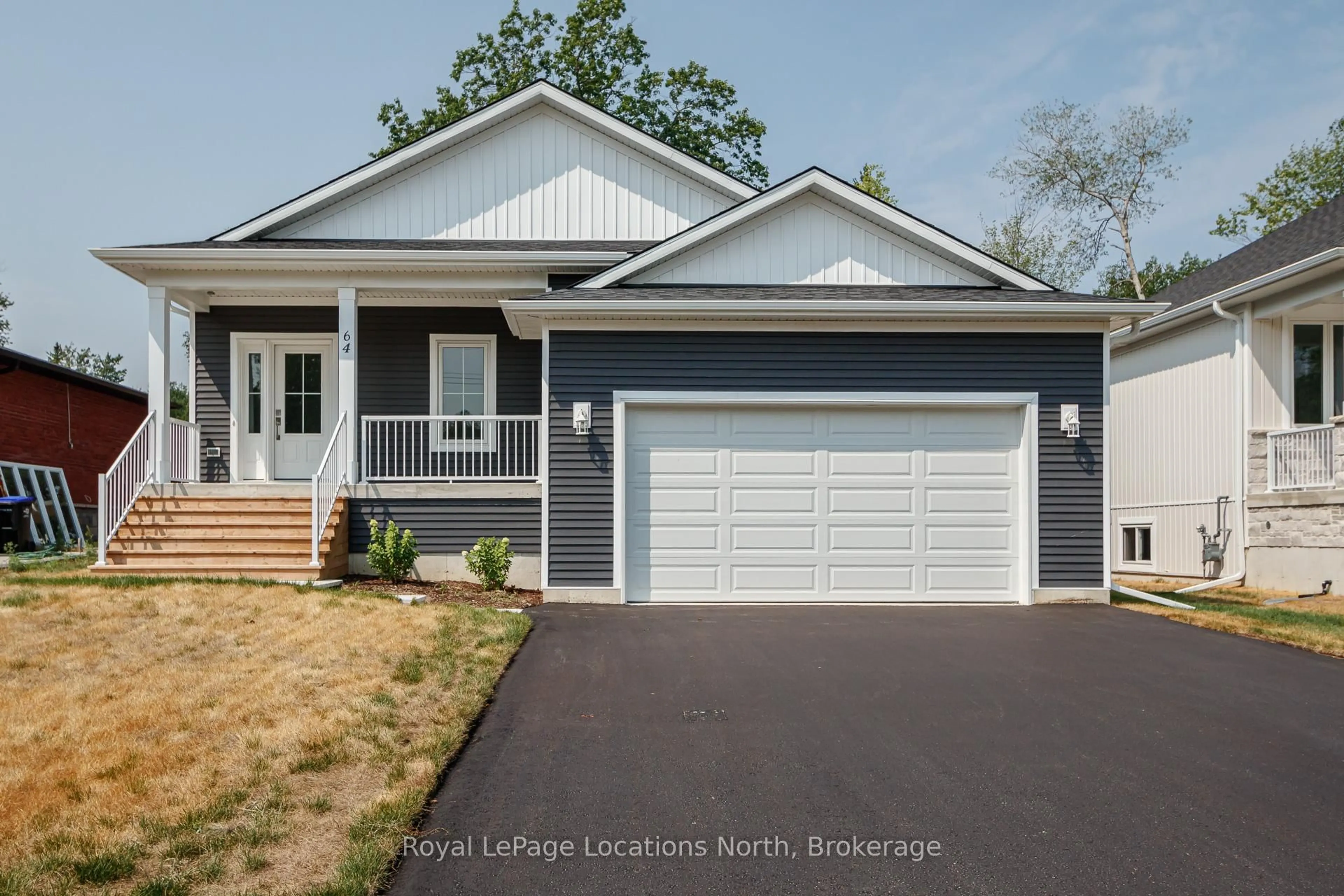 Home with vinyl exterior material, street for 64 52nd St, Wasaga Beach Ontario L9Z 1W8