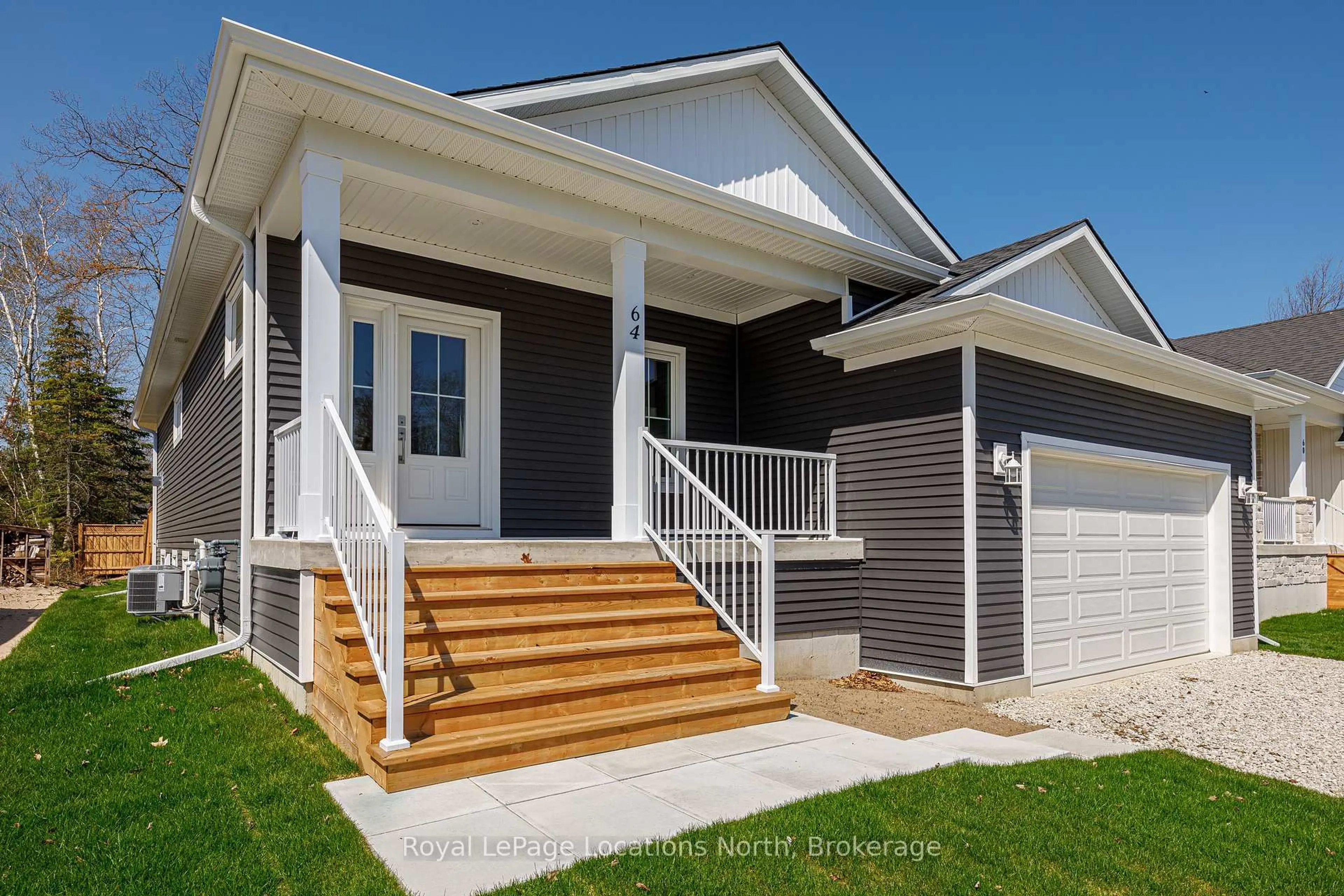 Home with vinyl exterior material, street for 64 52nd St, Wasaga Beach Ontario L9Z 1W8