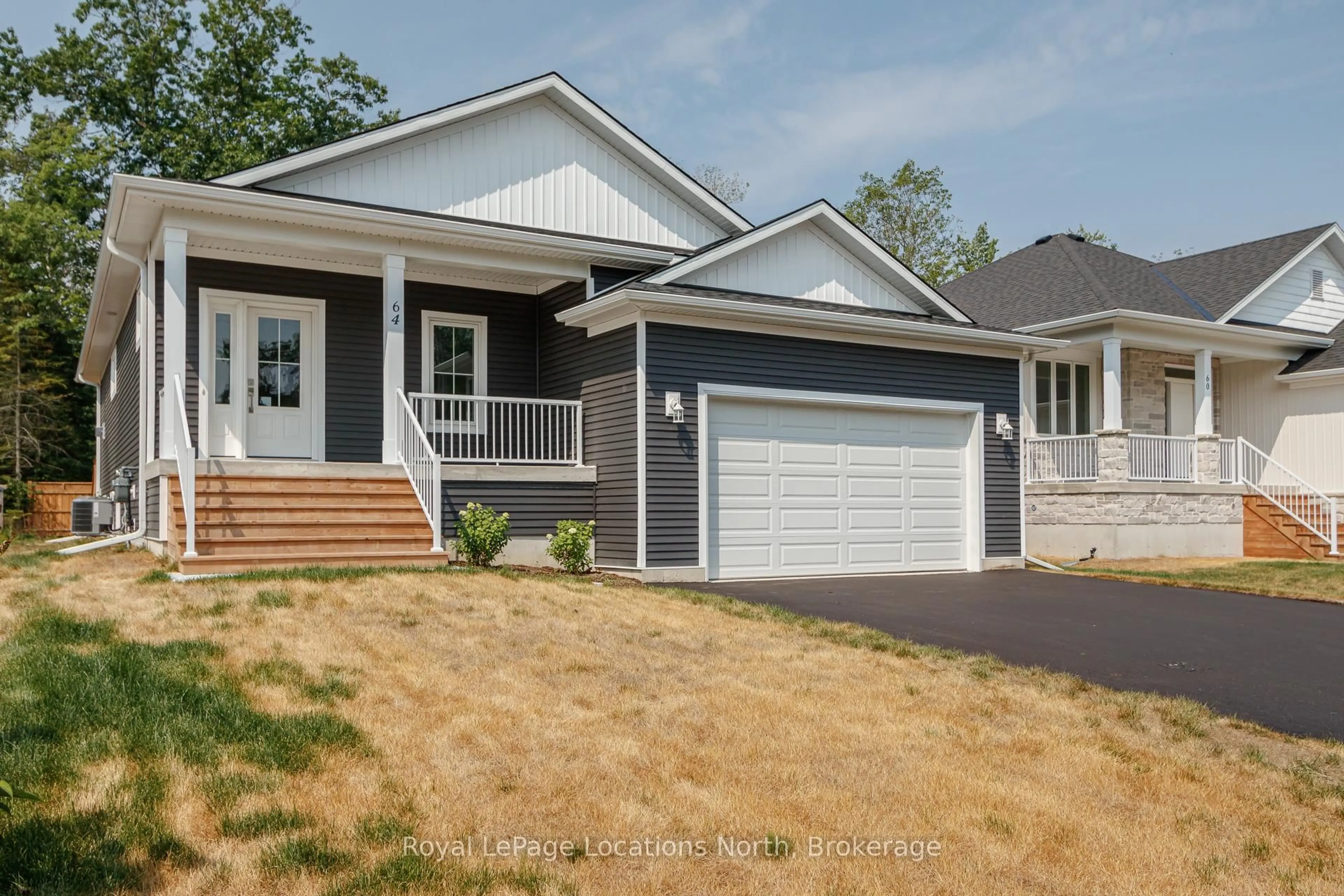 Home with vinyl exterior material, street for 64 52nd St, Wasaga Beach Ontario L9Z 1W8