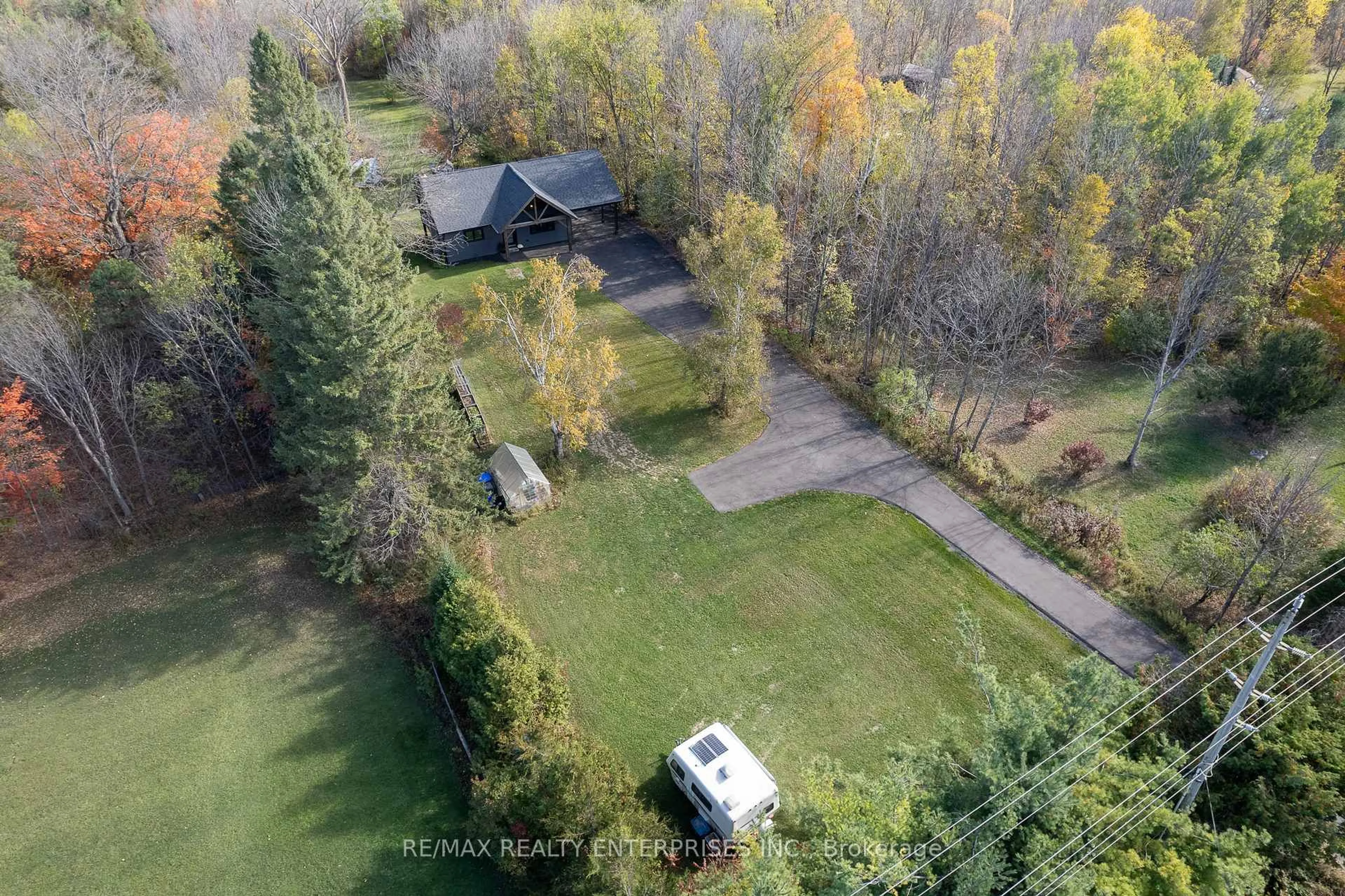 A pic from outside/outdoor area/front of a property/back of a property/a pic from drone, forest/trees view for 2035 Quarry Rd, Severn Ontario L0K 1E0