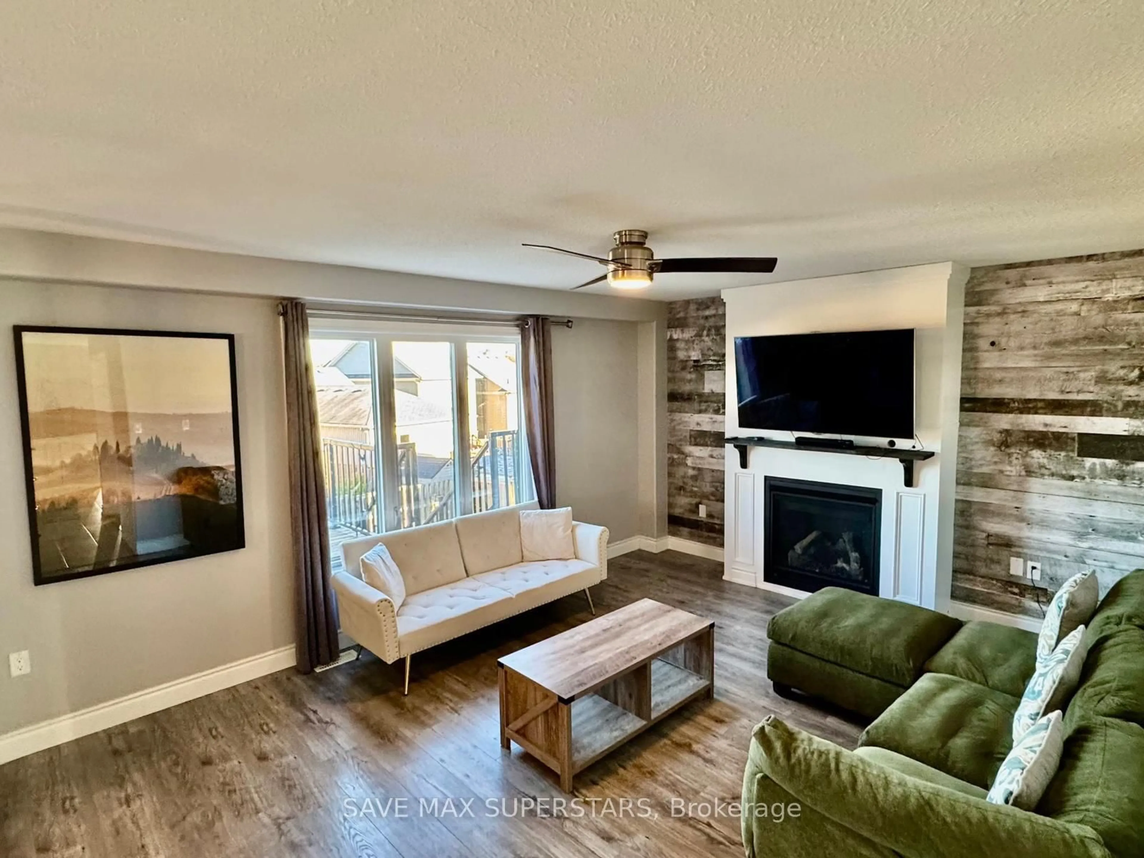 Living room with furniture, wood/laminate floor for 3063 Emperor Dr, Orillia Ontario L3V 0G4