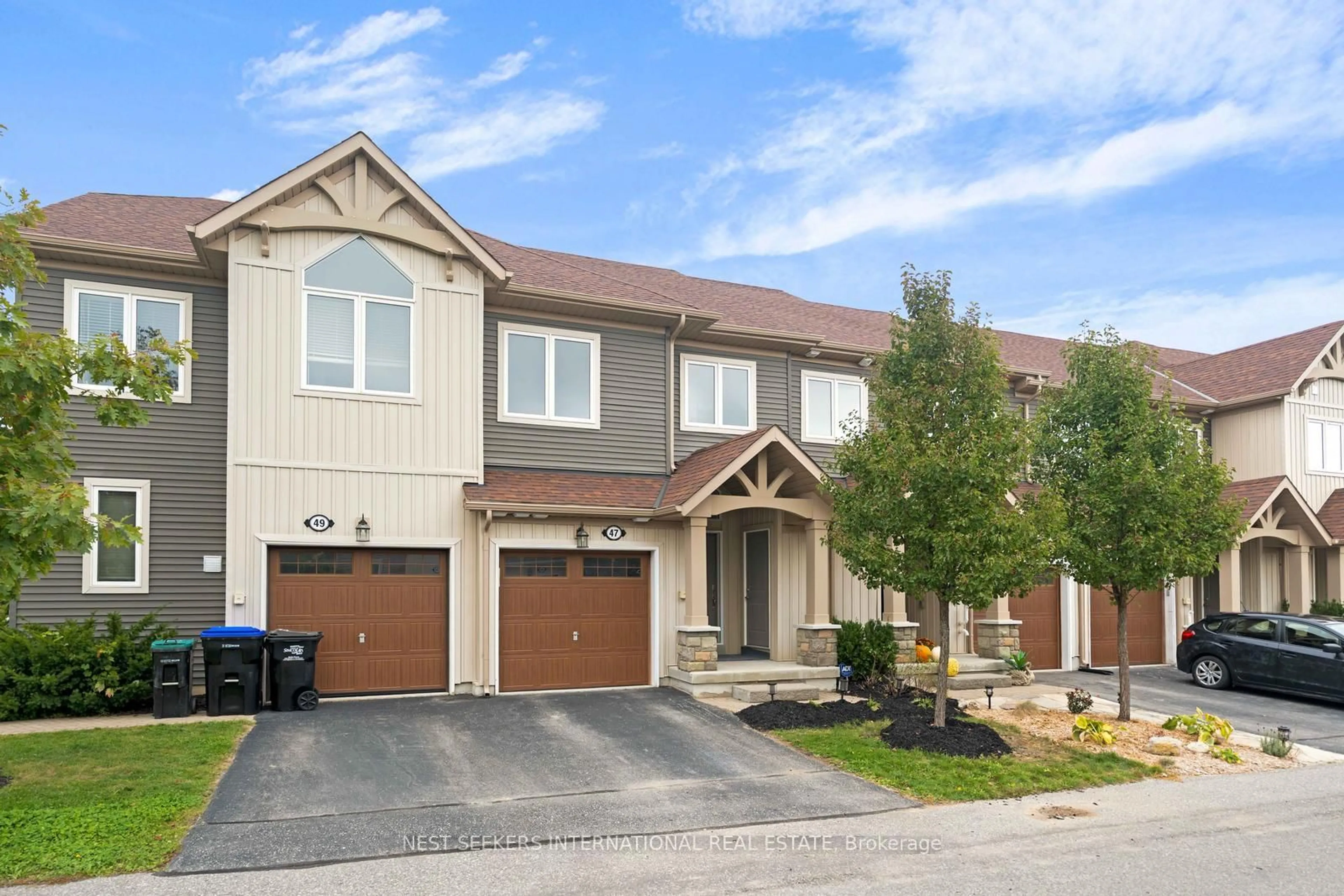 Home with brick exterior material, street for 47 Lett Ave, Collingwood Ontario L9Y 0Z5