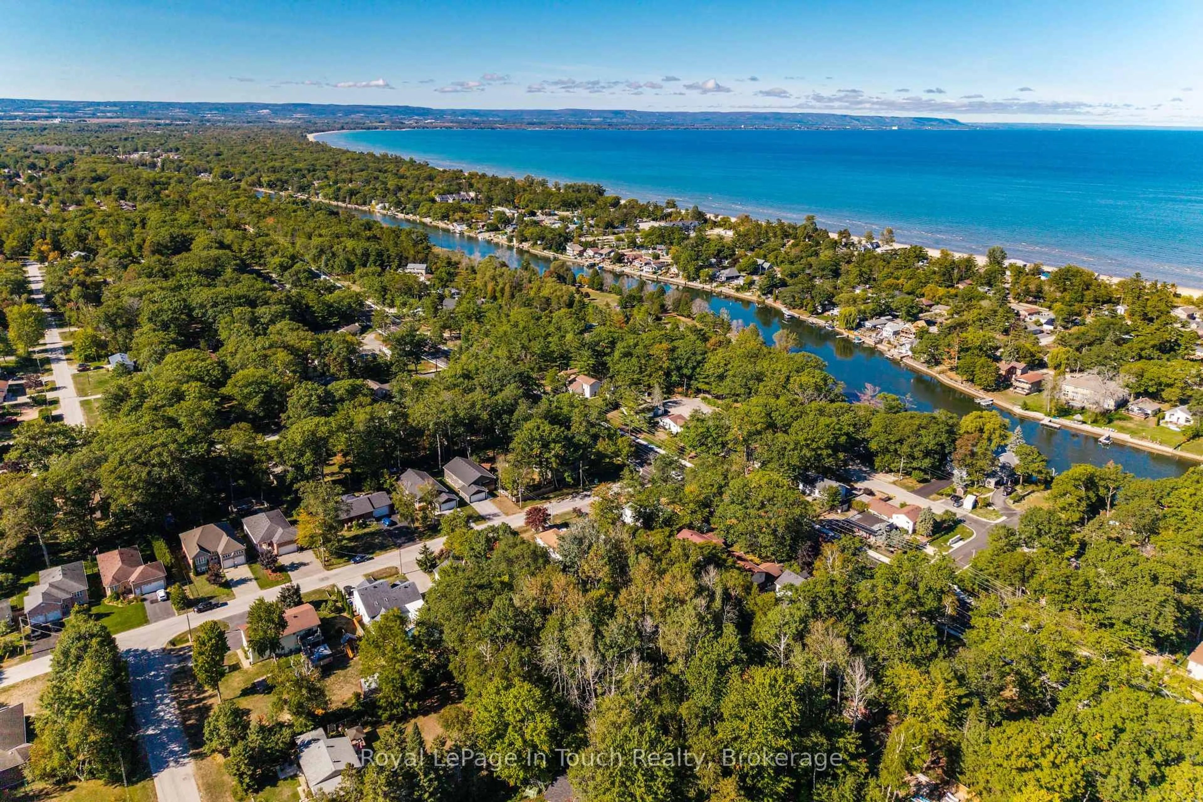 A pic from outside/outdoor area/front of a property/back of a property/a pic from drone, water/lake/river/ocean view for 23 Caribbean Dr, Wasaga Beach Ontario L9Z 2W3