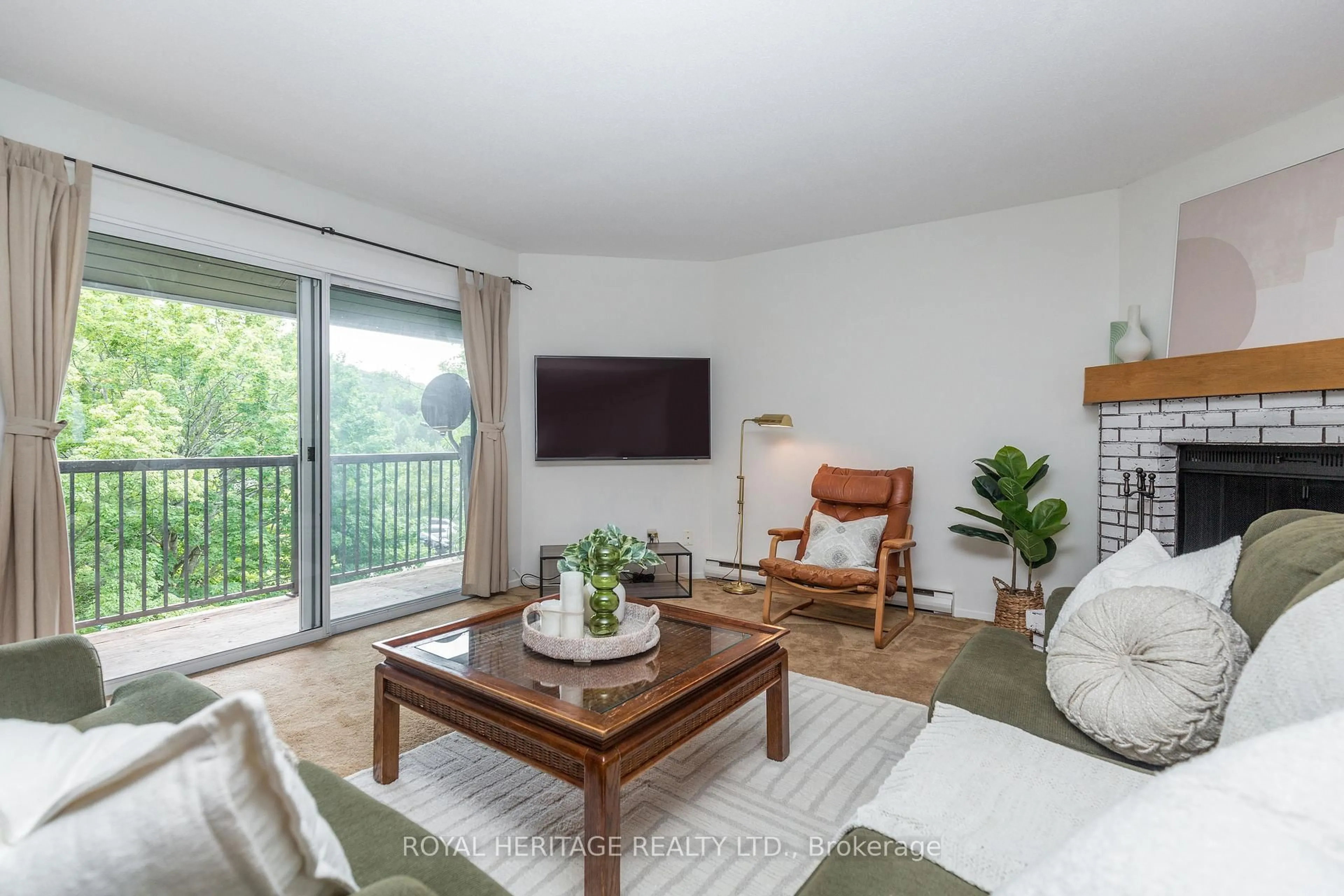 Living room with furniture, wood/laminate floor for 1102 Horseshoe Valley Rd #311, Oro-Medonte Ontario L4M 4Y8
