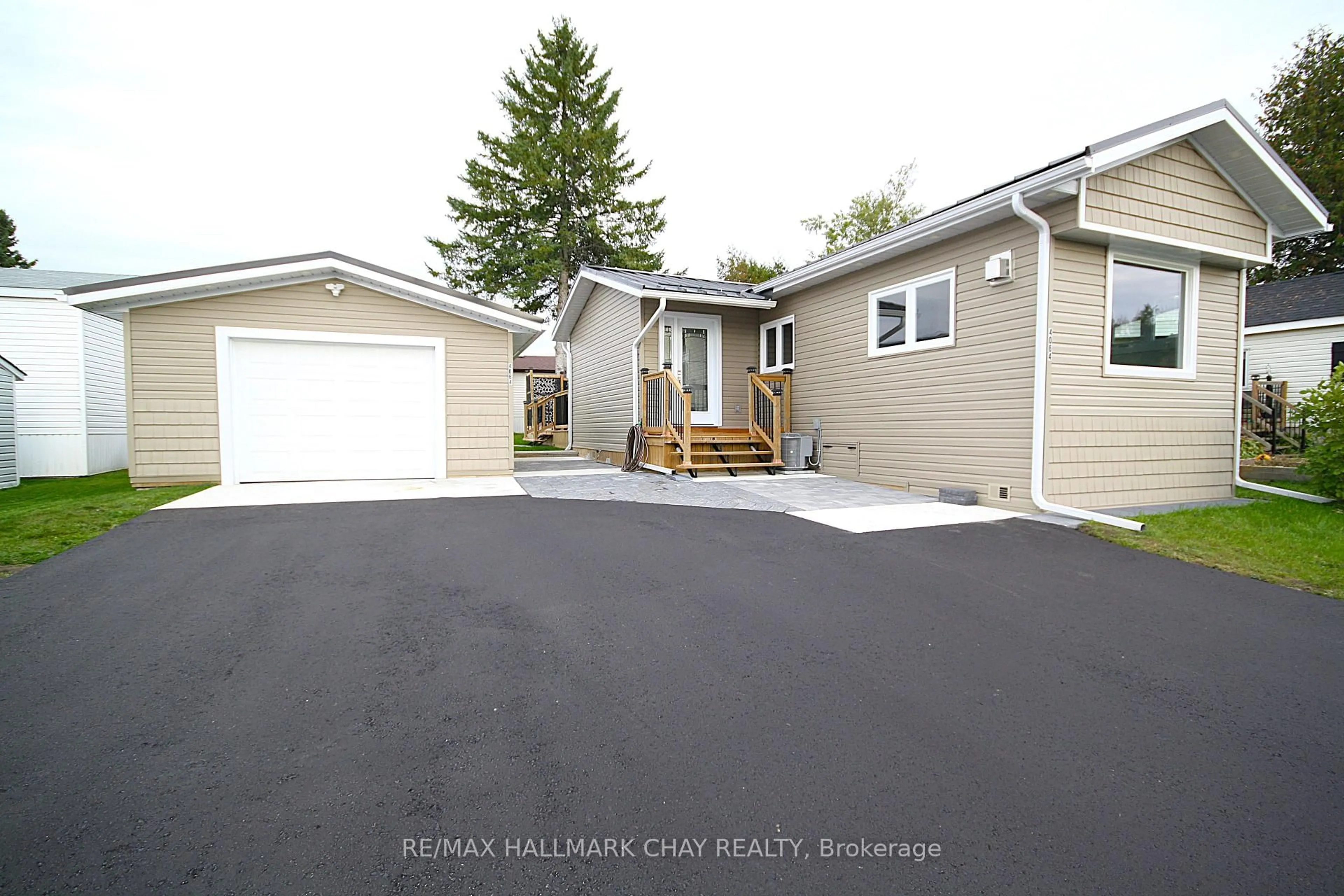 Home with vinyl exterior material, street for 4064 ASH Cres, Severn Ontario L3V 6H4
