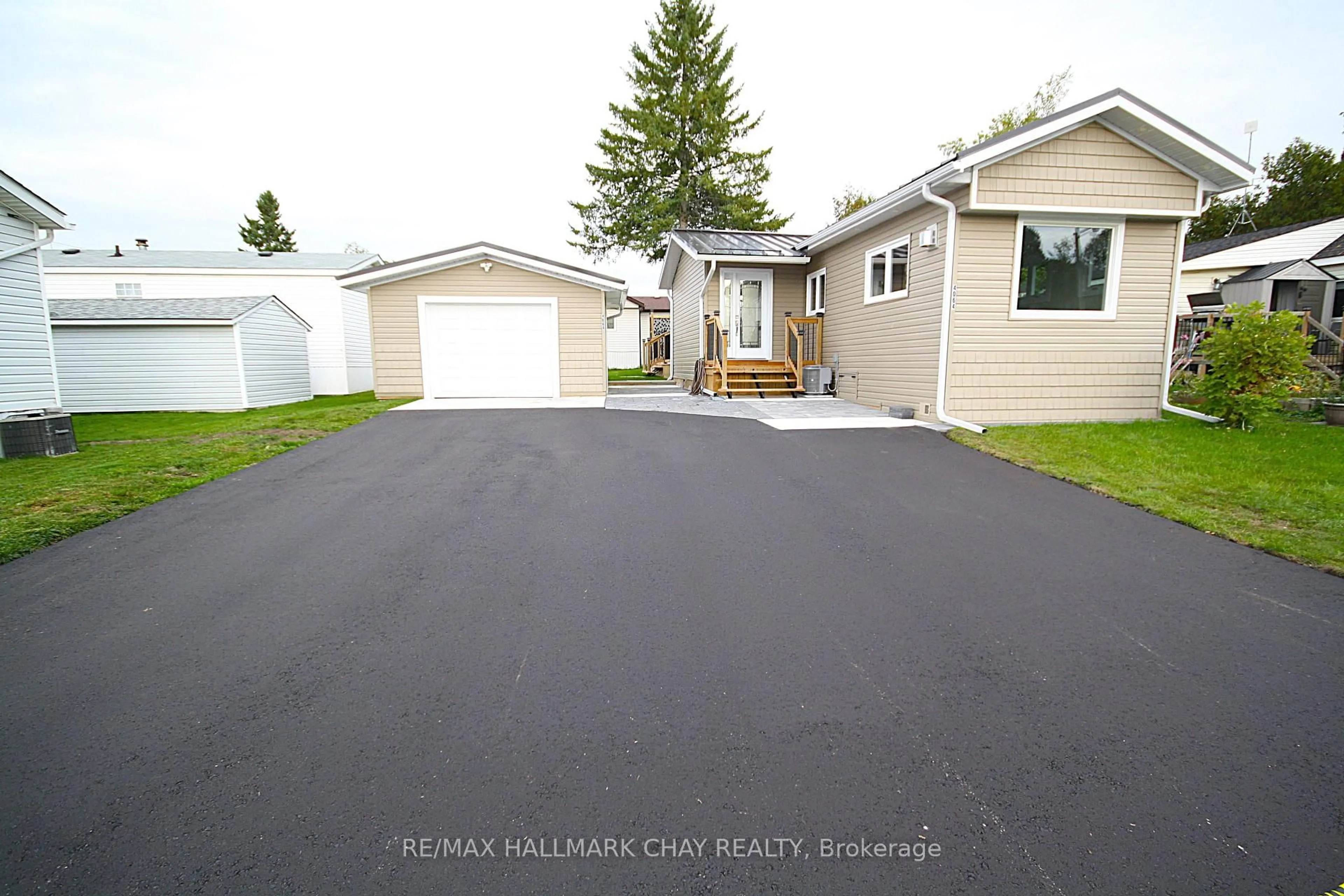 Home with vinyl exterior material, street for 4064 ASH Cres, Severn Ontario L3V 6H4