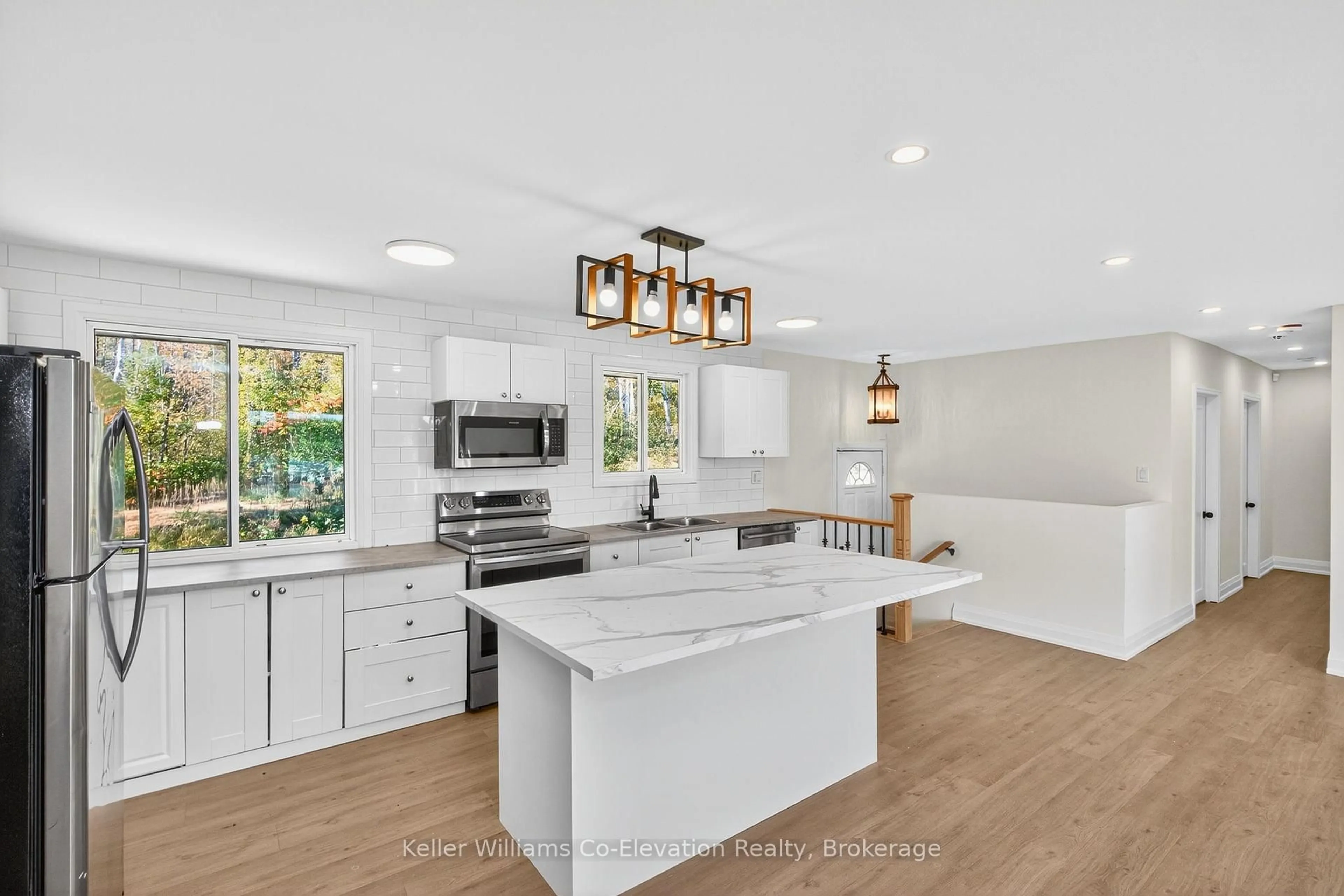 Open concept kitchen, ceramic/tile floor for 556 Champlain Rd, Tiny Ontario L9M 0C2