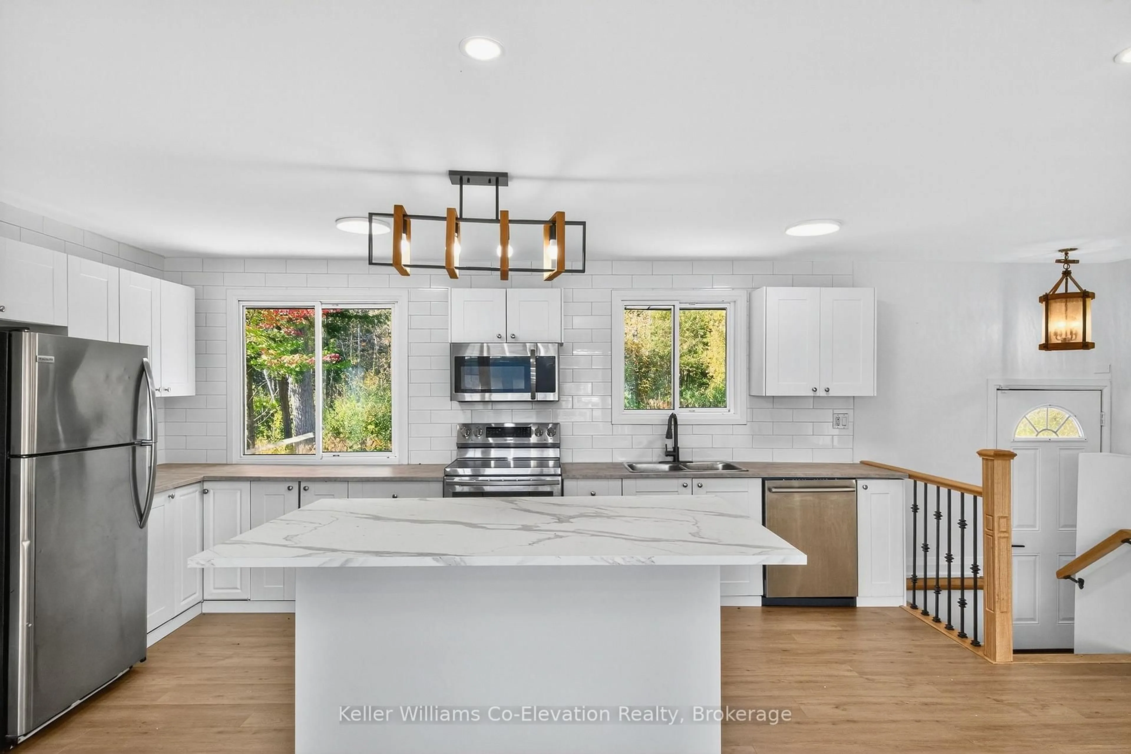 Open concept kitchen, ceramic/tile floor for 556 Champlain Rd, Tiny Ontario L9M 0C2