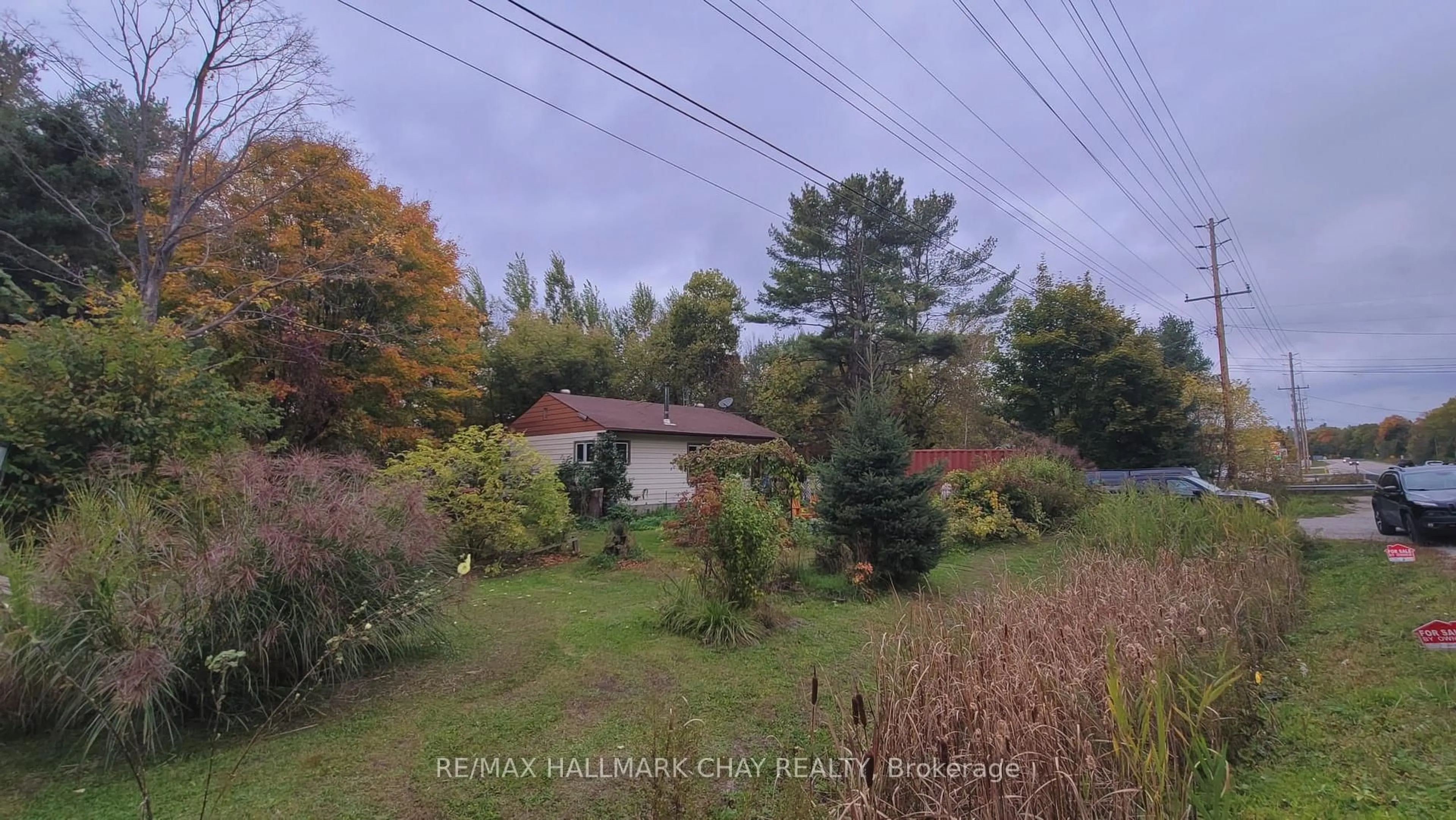 A pic from outside/outdoor area/front of a property/back of a property/a pic from drone, forest/trees view for 14189 12 Highway, Tay Ontario L0K 2C0