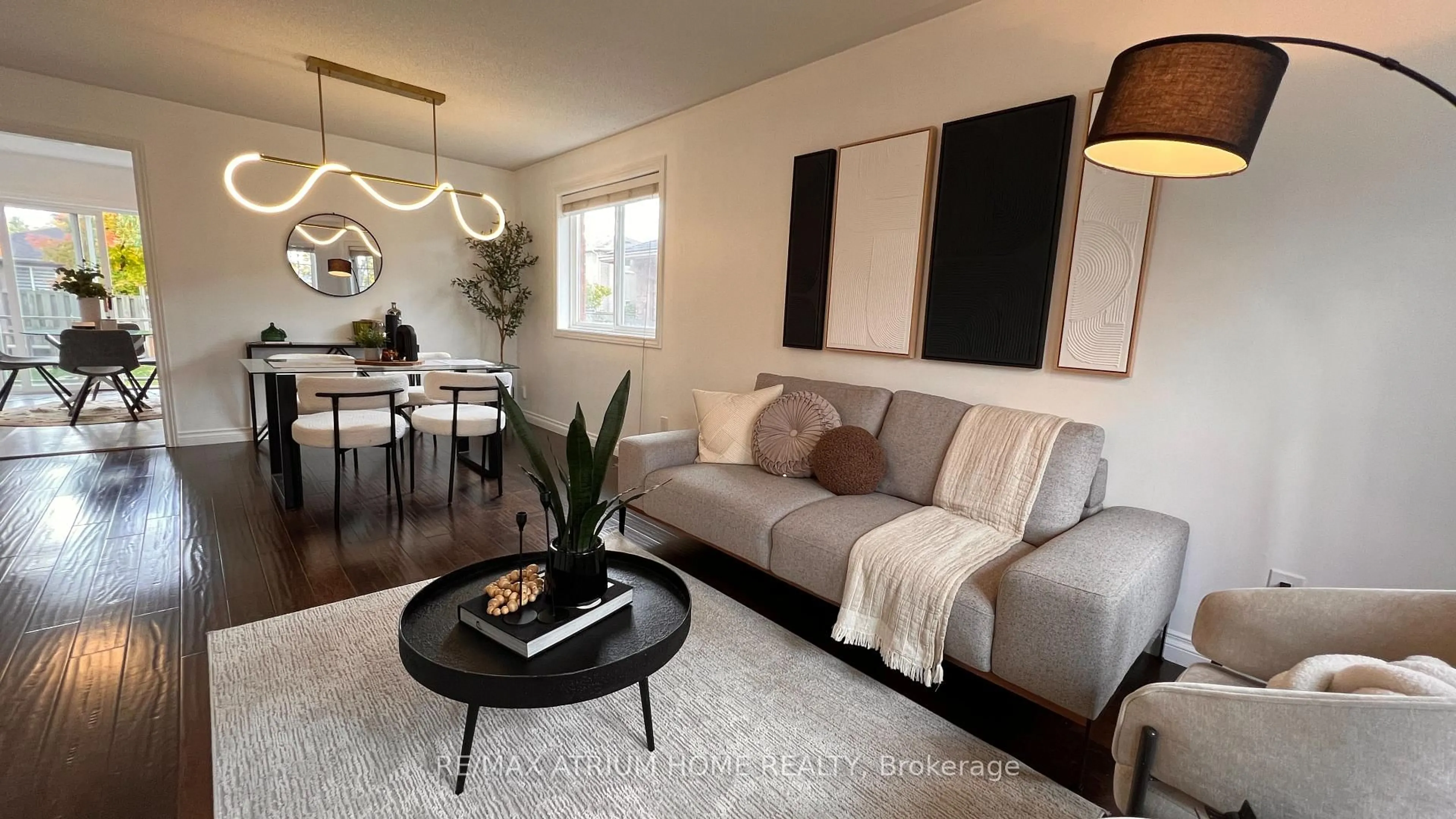 Living room with furniture, wood/laminate floor for 124 Monique Cres, Barrie Ontario L4M 6Y8