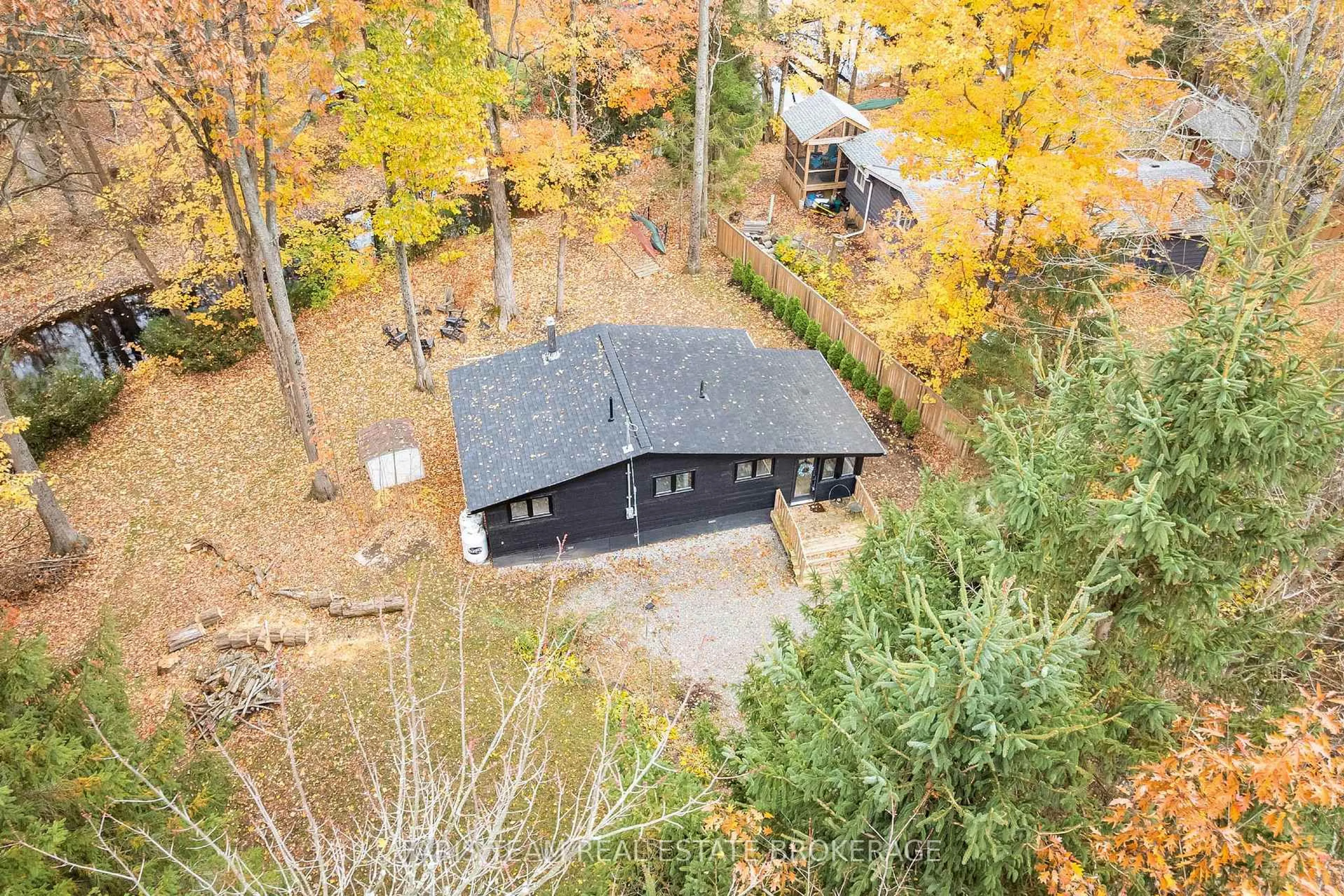 A pic from outside/outdoor area/front of a property/back of a property/a pic from drone, forest/trees view for 7475 Island Cres, Severn Ontario L0K 2B0