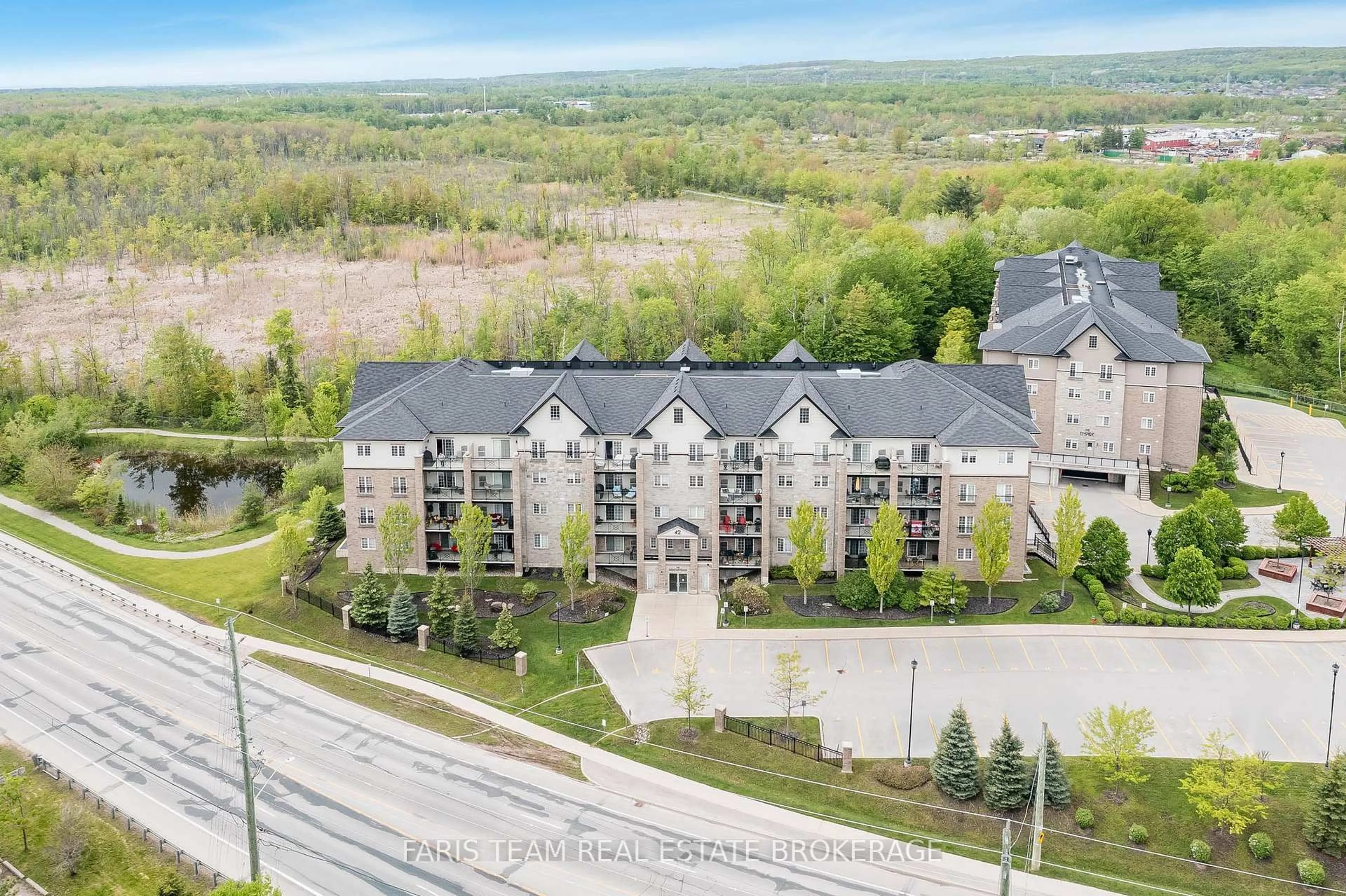 A pic from outside/outdoor area/front of a property/back of a property/a pic from drone, unknown for 42 Ferndale Dr #402, Barrie Ontario L4N 2M5