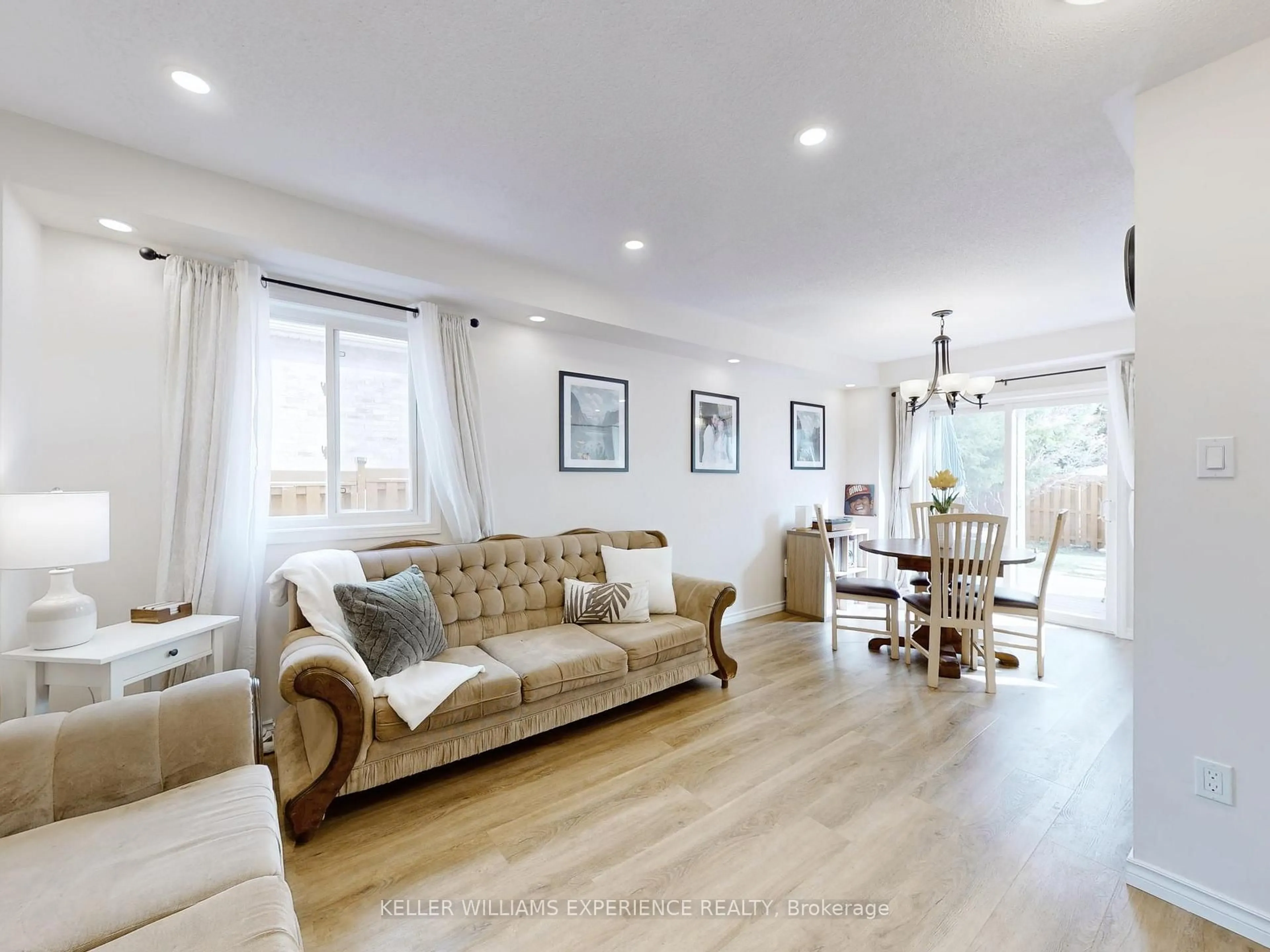 Living room with furniture, wood/laminate floor for 31 Gross Dr, Barrie Ontario L4N 0R6