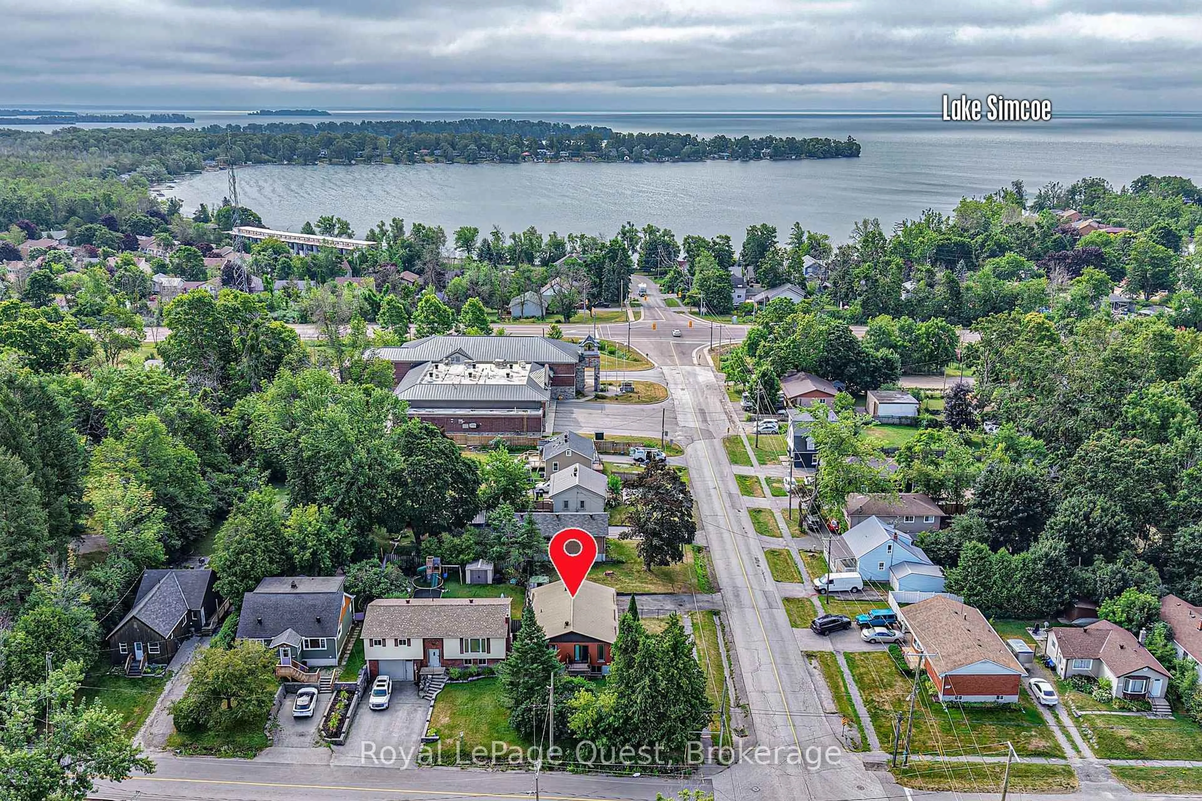 A pic from outside/outdoor area/front of a property/back of a property/a pic from drone, water/lake/river/ocean view for 129 Simcoe St, Orillia Ontario L3V 1G8