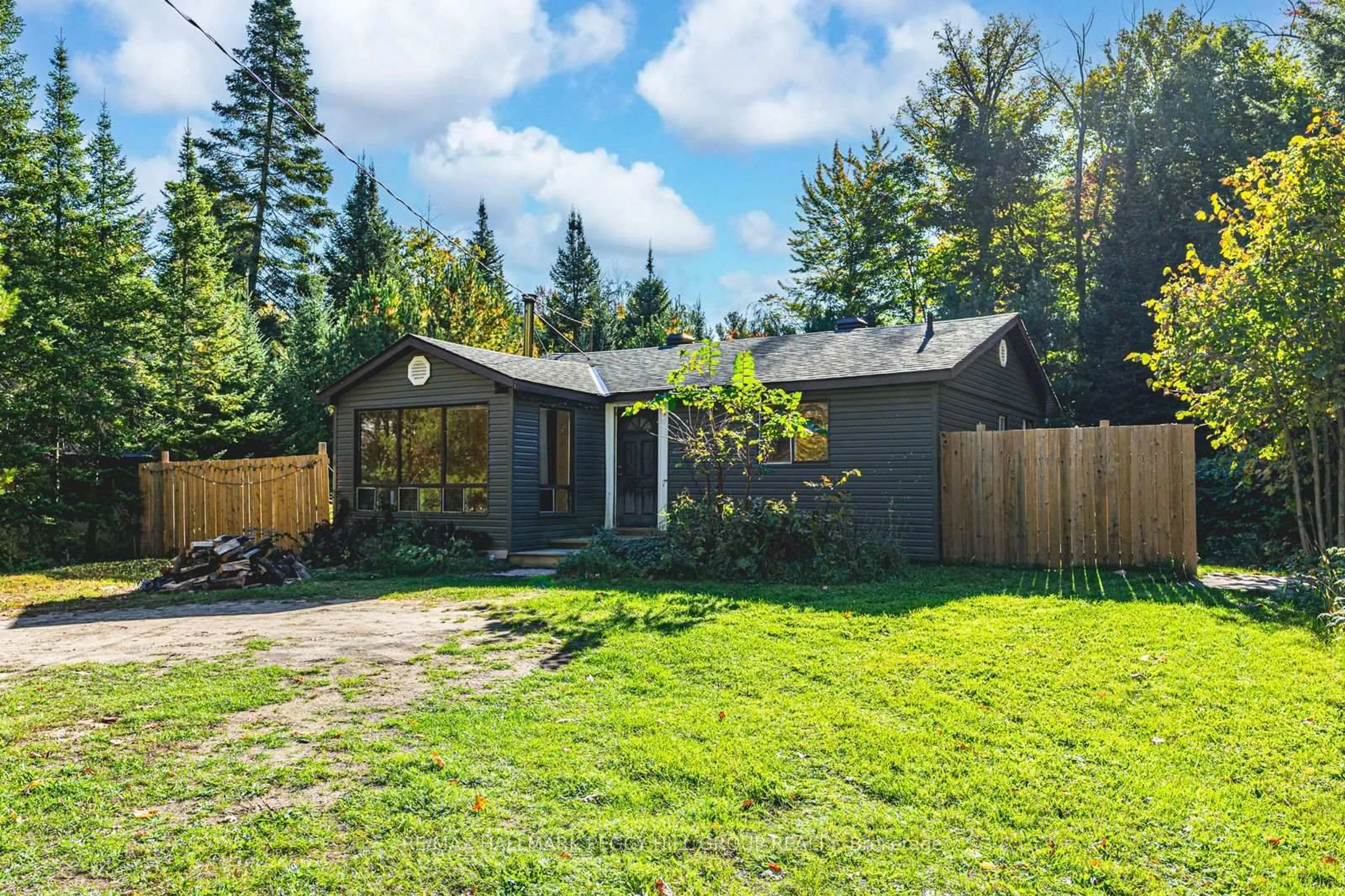 A pic from outside/outdoor area/front of a property/back of a property/a pic from drone, forest/trees view for 138 Moreau Pkwy, Tiny Ontario L9M 0H3