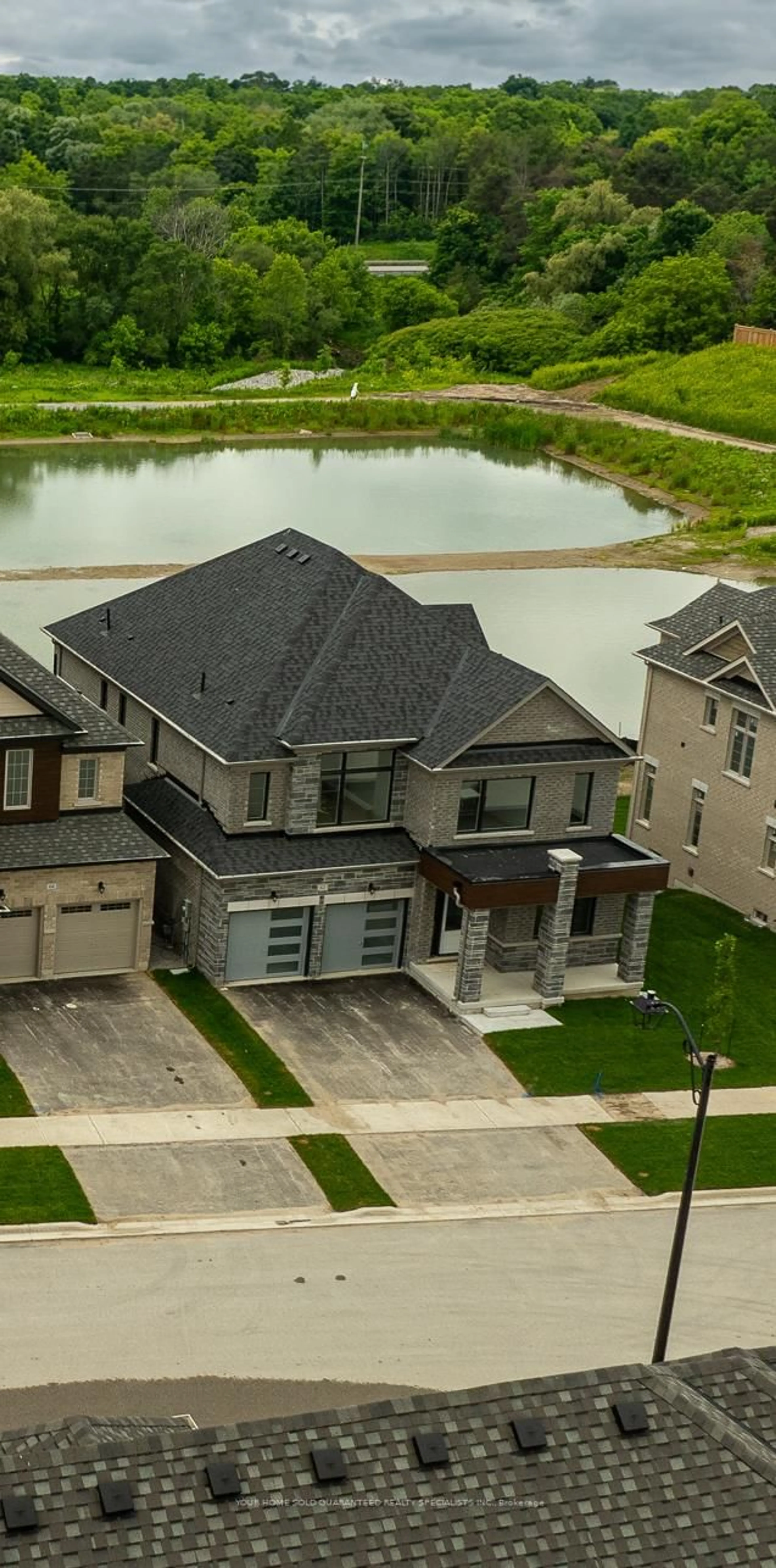 A pic from outside/outdoor area/front of a property/back of a property/a pic from drone, street for 62 Calypso Ave, Springwater Ontario L0L 1Y3