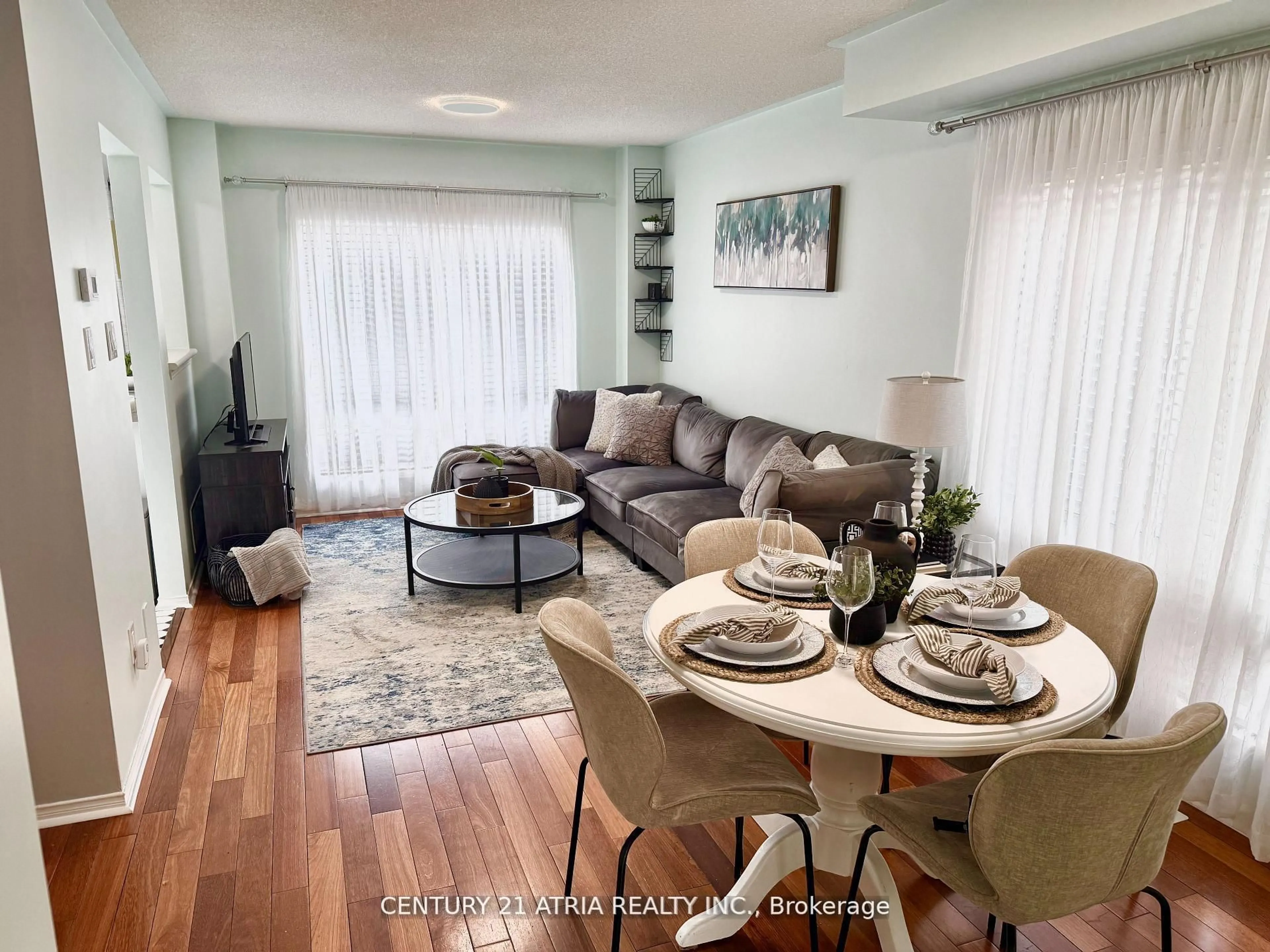 Living room with furniture, wood/laminate floor for 12 Lyfytt Cres, Barrie Ontario L4N 7X4