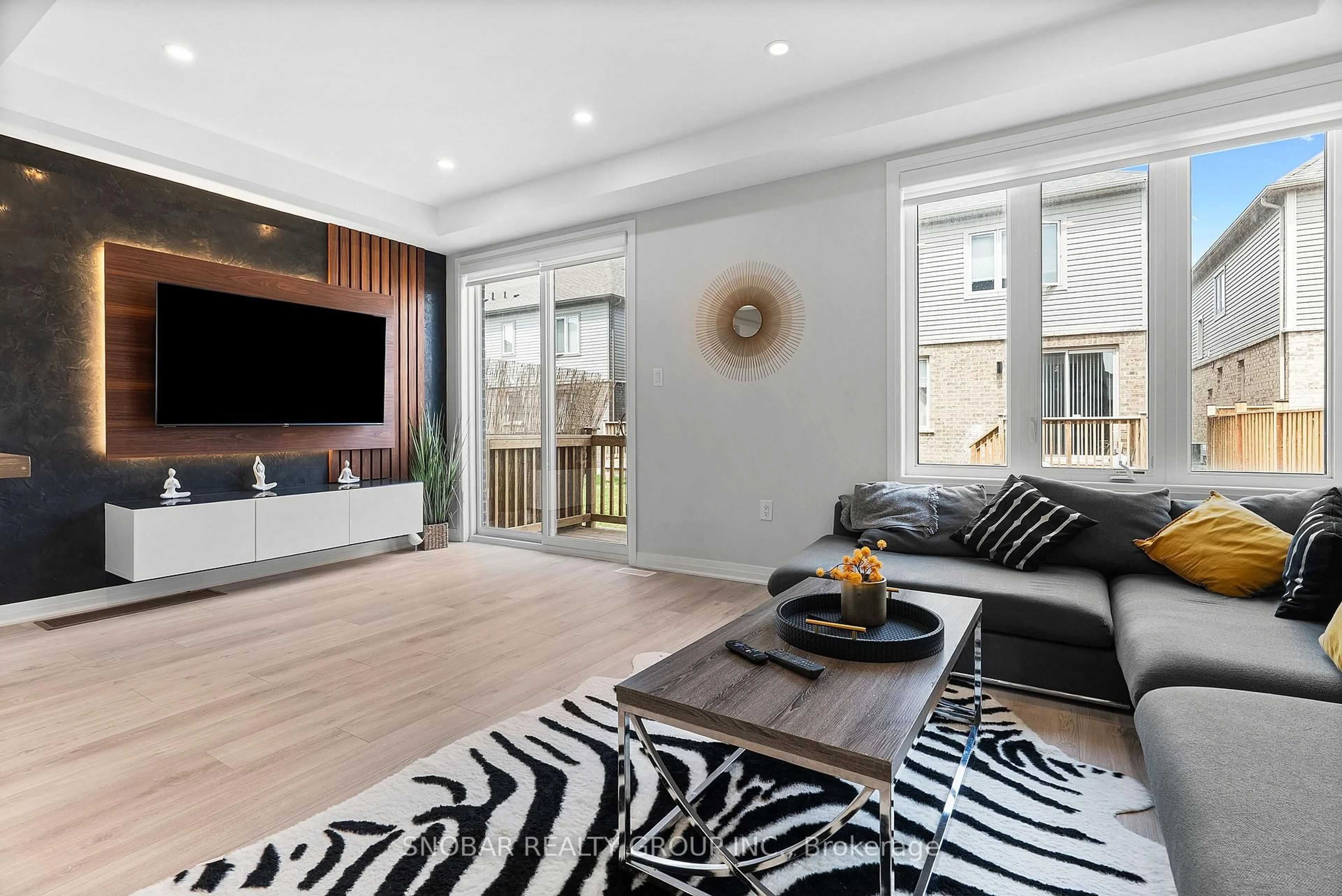 Living room with furniture, wood/laminate floor for 95 Shepherd Dr, Barrie Ontario L9J 0K4