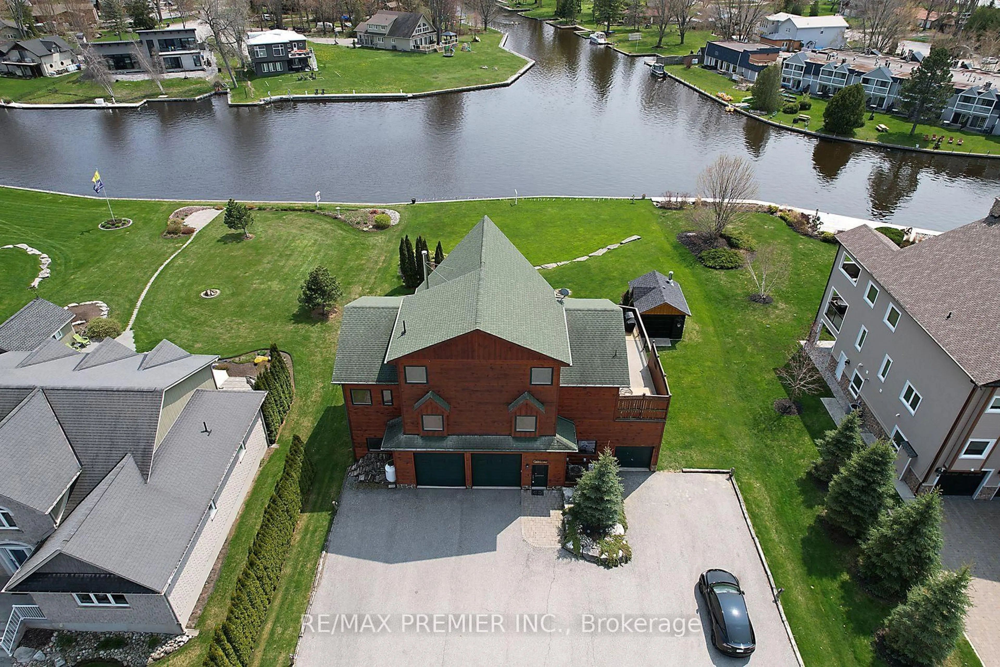 A pic from outside/outdoor area/front of a property/back of a property/a pic from drone, water/lake/river/ocean view for 31 Paradise Blvd, Ramara Ontario L0K 1B0