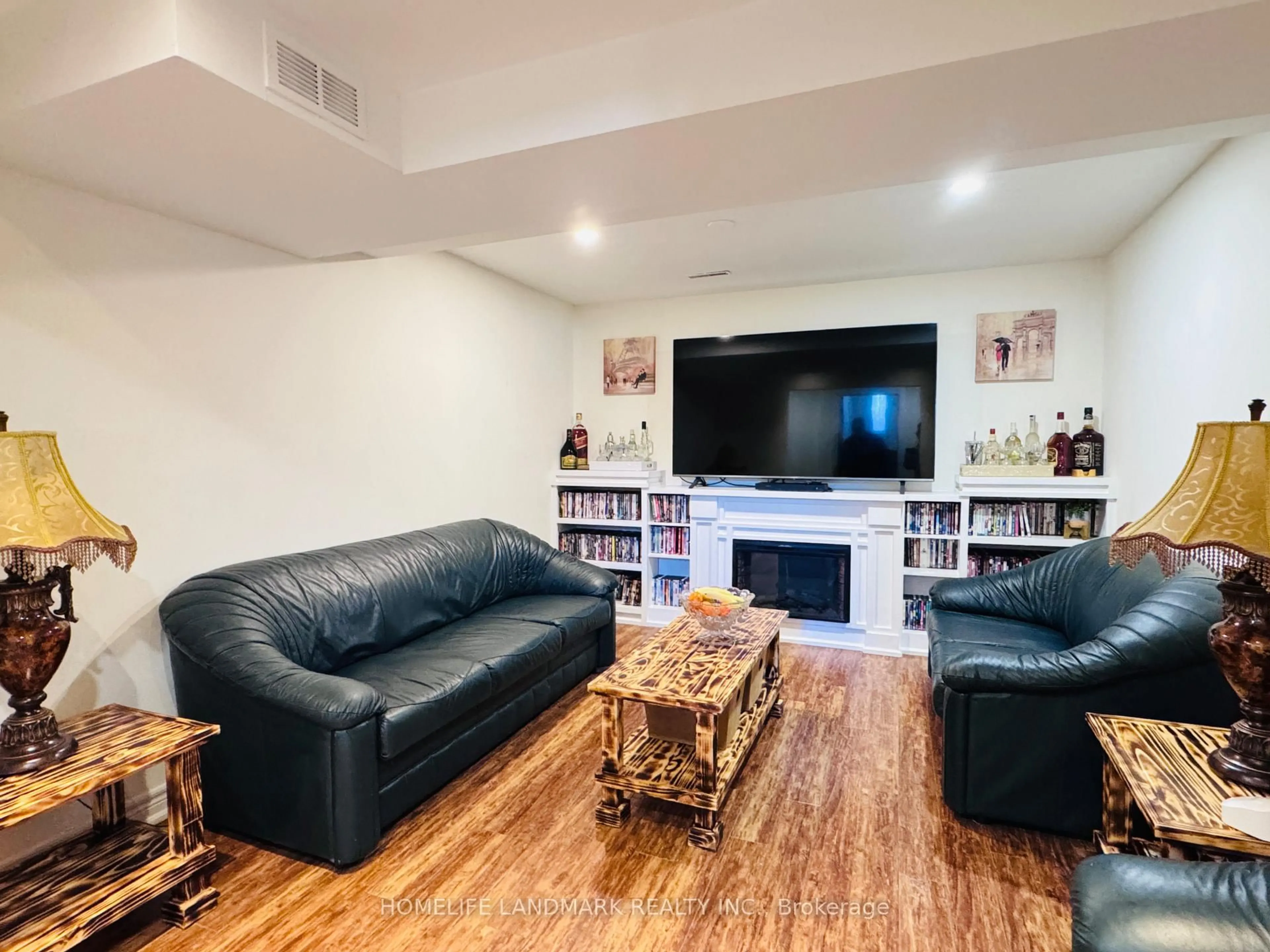 Living room with furniture, wood/laminate floor for 274 Edgehill Dr, Barrie Ontario L4N 7W9