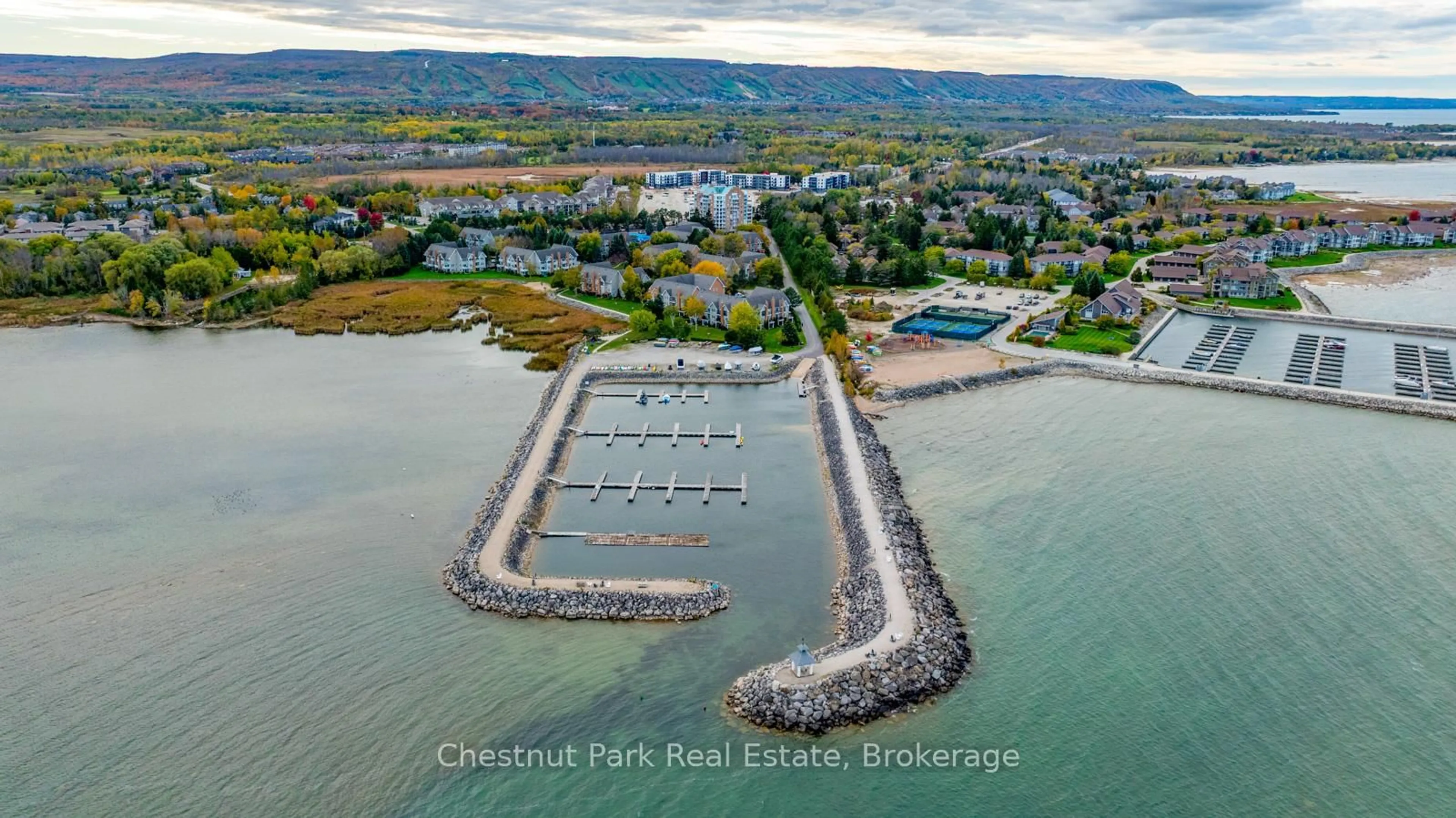 A pic from outside/outdoor area/front of a property/back of a property/a pic from drone, water/lake/river/ocean view for 18 Ramblings Way #97, Collingwood Ontario L9Y 5C6