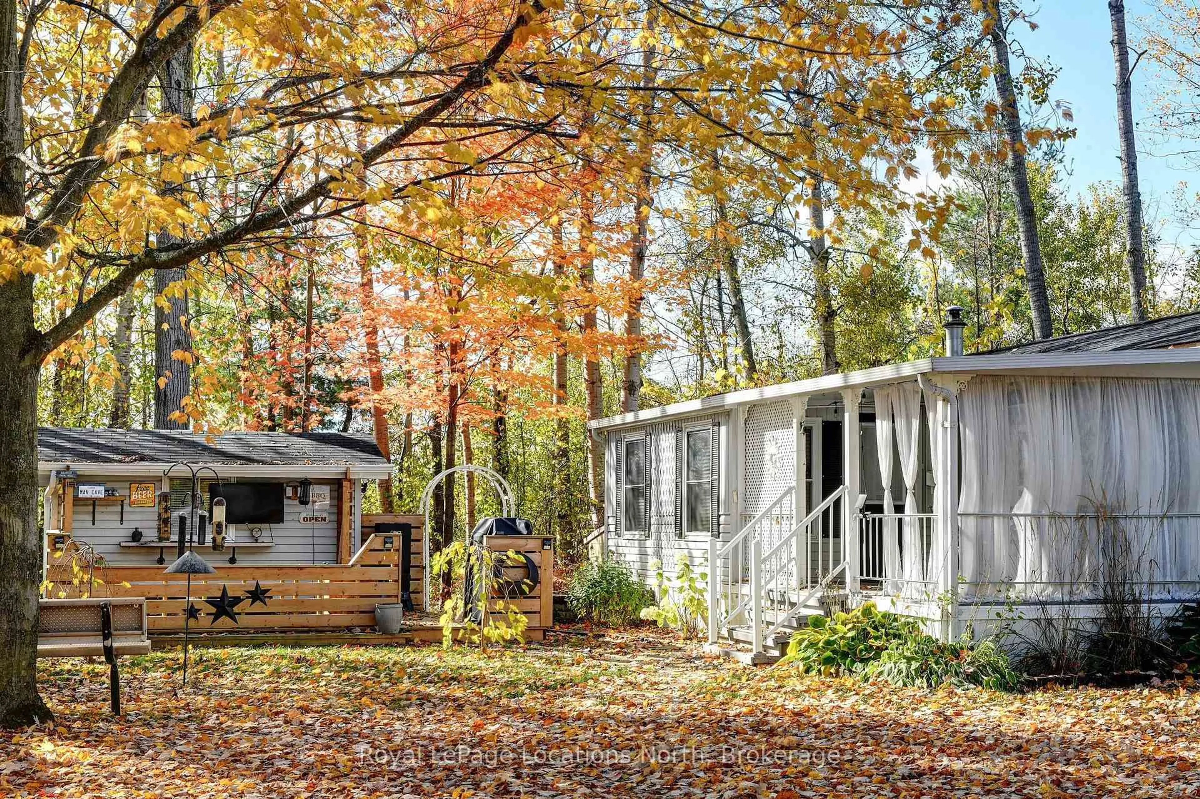 Home with vinyl exterior material, forest/trees view for 8 Prince Edward Dr, Springwater Ontario L0L 1P0