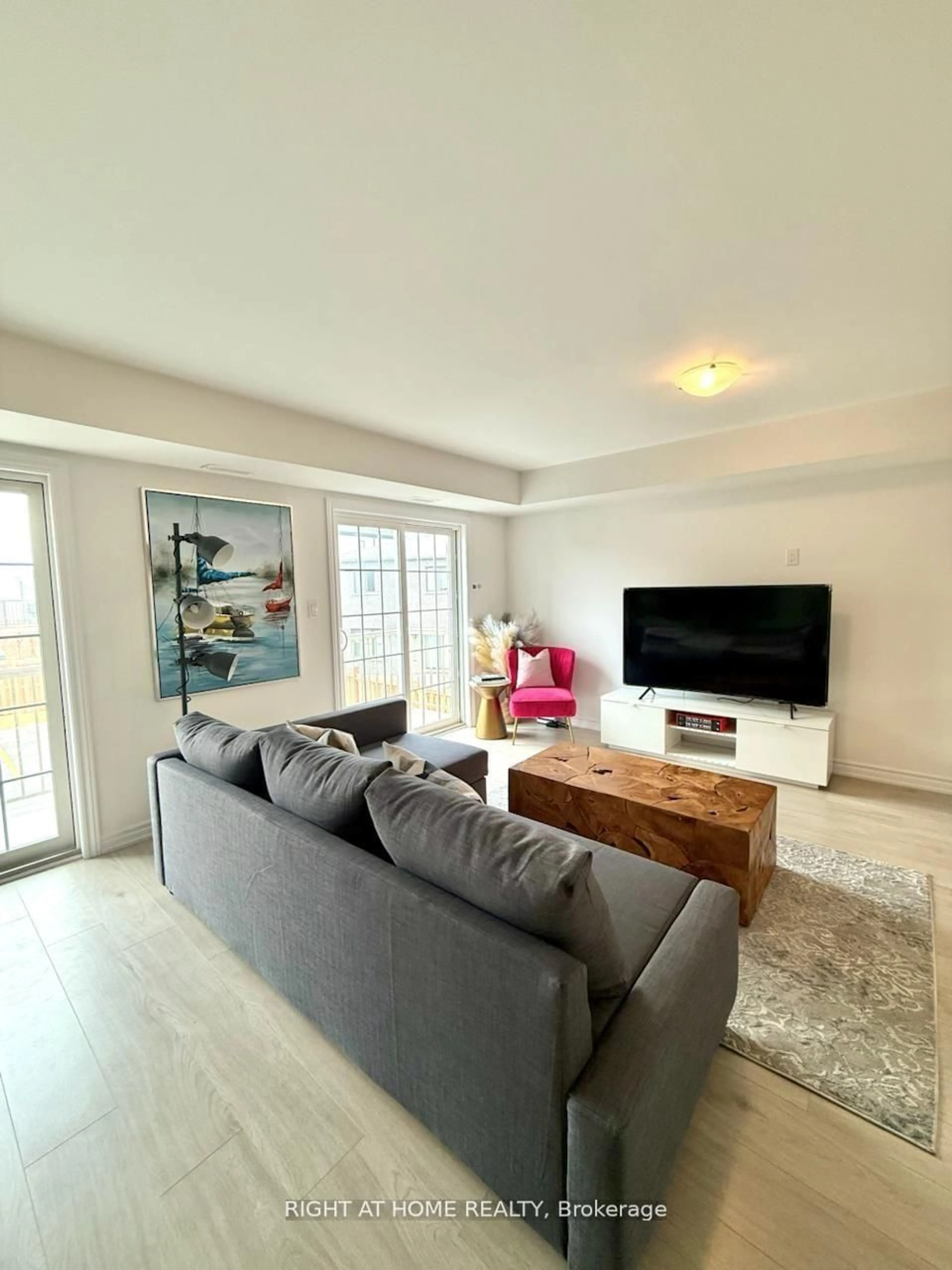 Living room with furniture, wood/laminate floor for 31 PUMPKIN CORNER Cres ##2, Barrie Ontario L9J 0T5