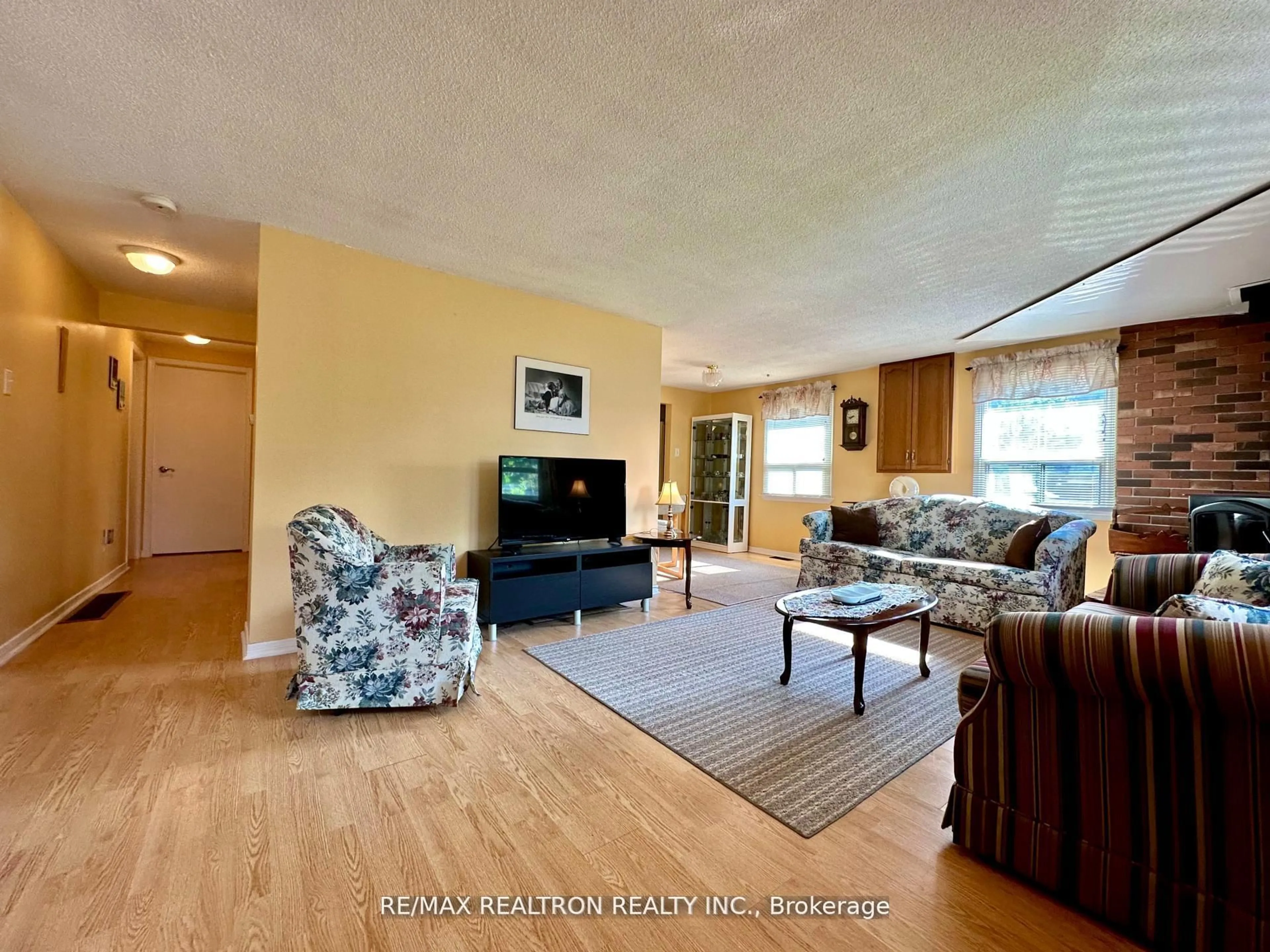 Living room with furniture, wood/laminate floor for 2763 Maple Tr, Ramara Ontario L0K 1B0