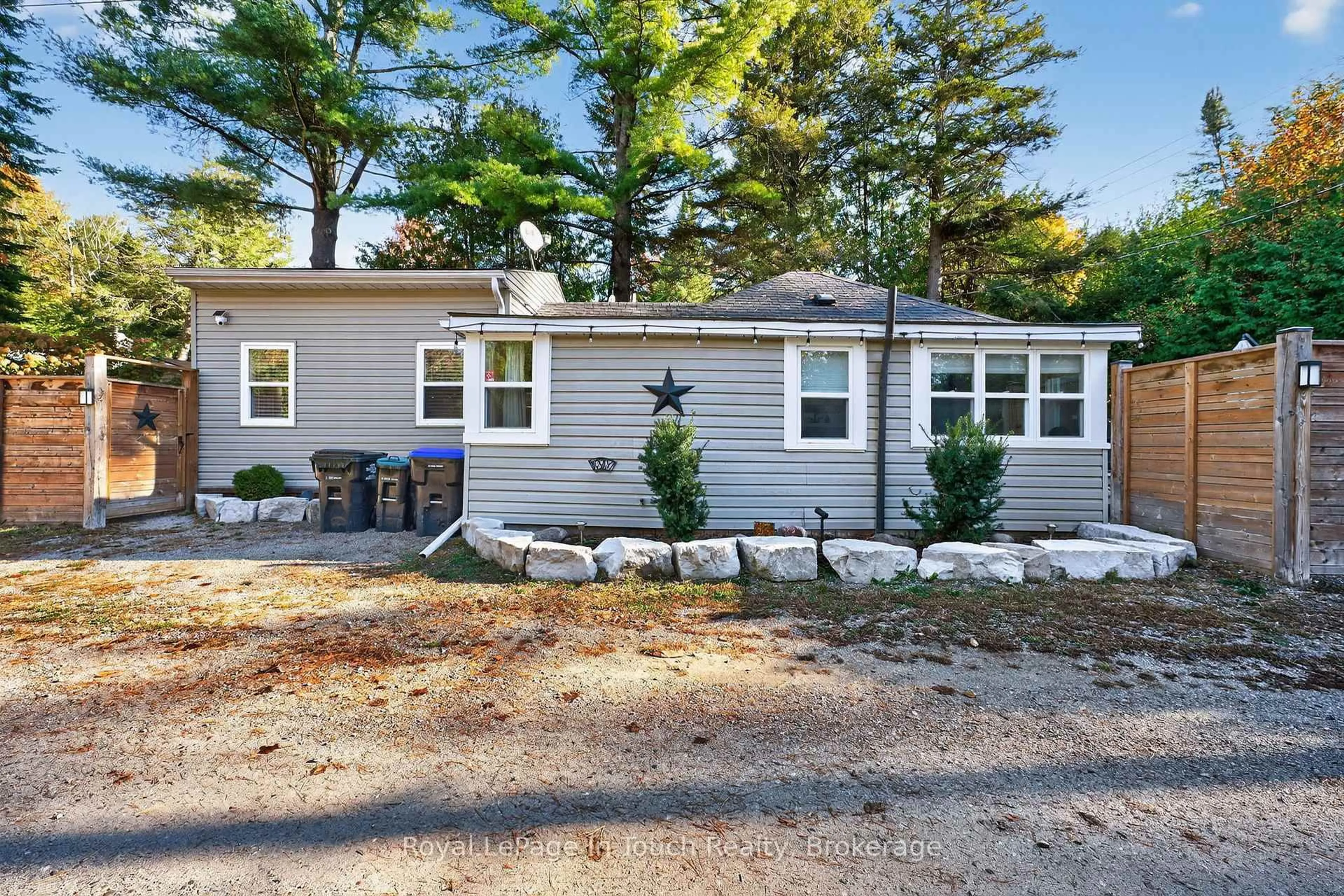 Home with vinyl exterior material, street for 302 Concession 11 Rd, Tiny Ontario L0L 2J0