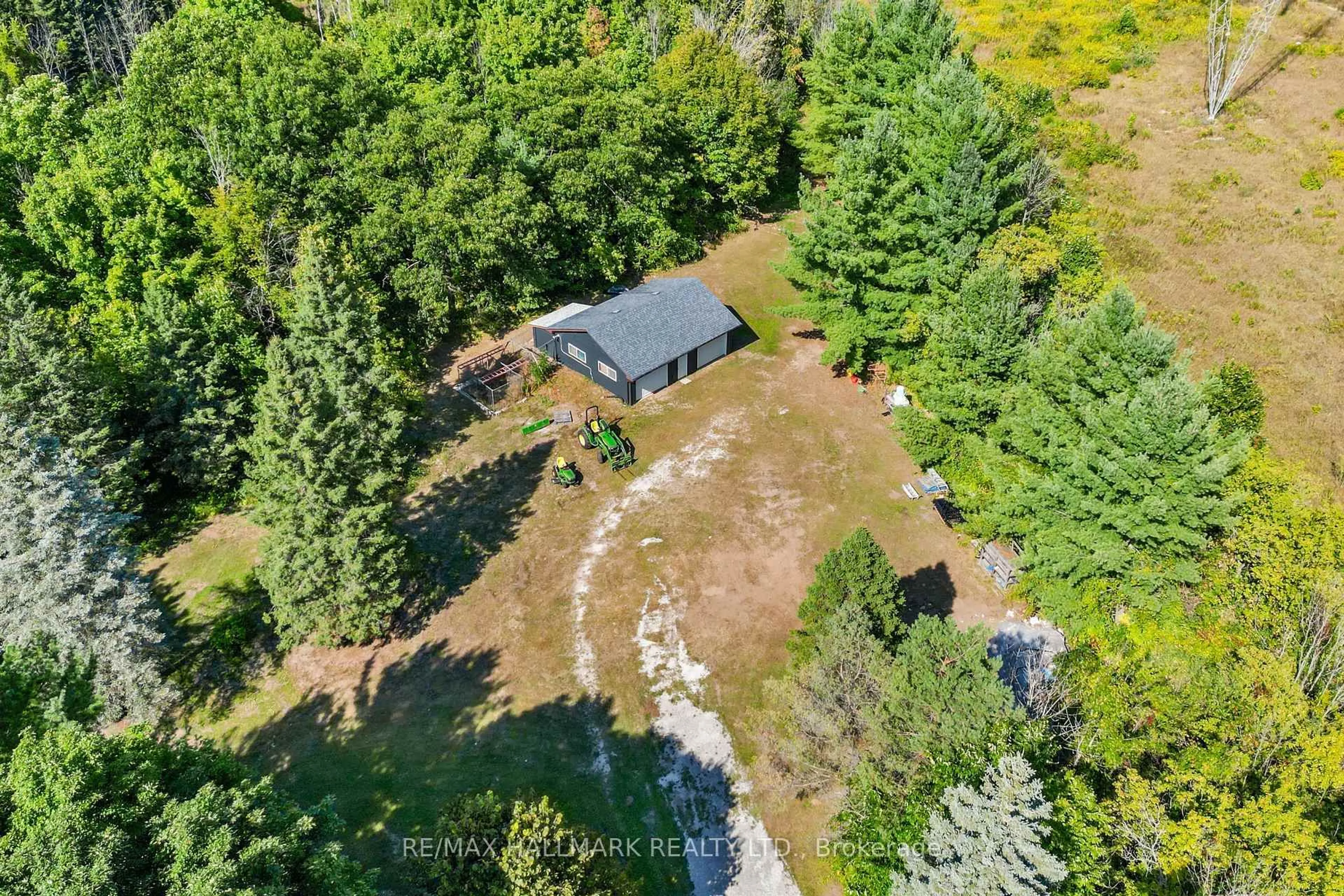 A pic from outside/outdoor area/front of a property/back of a property/a pic from drone, forest/trees view for 2422 Snow Valley Rd, Springwater Ontario L9X 1K1