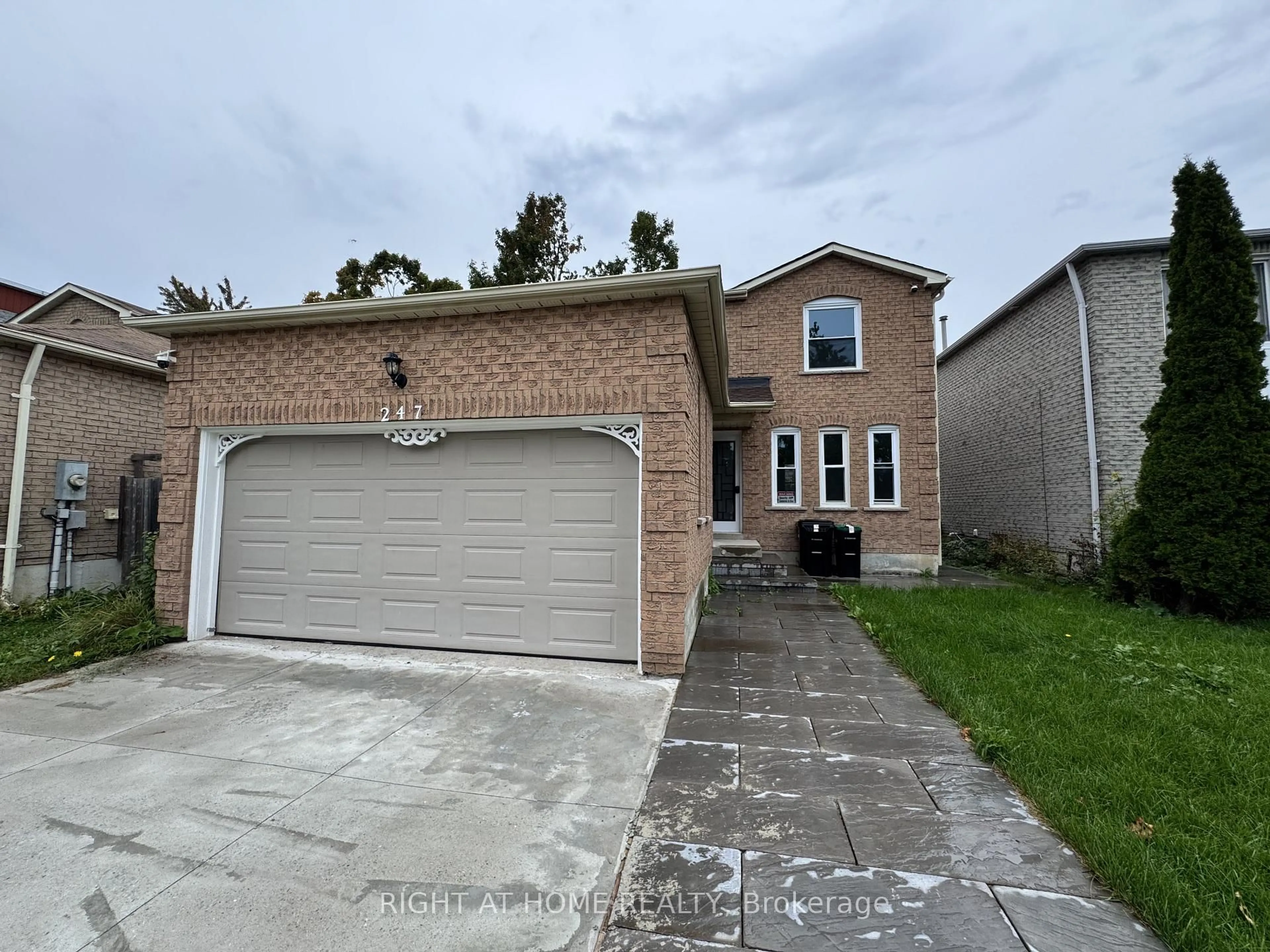 Home with brick exterior material, street for 247 Hickling Tr, Barrie Ontario L4M 5W9