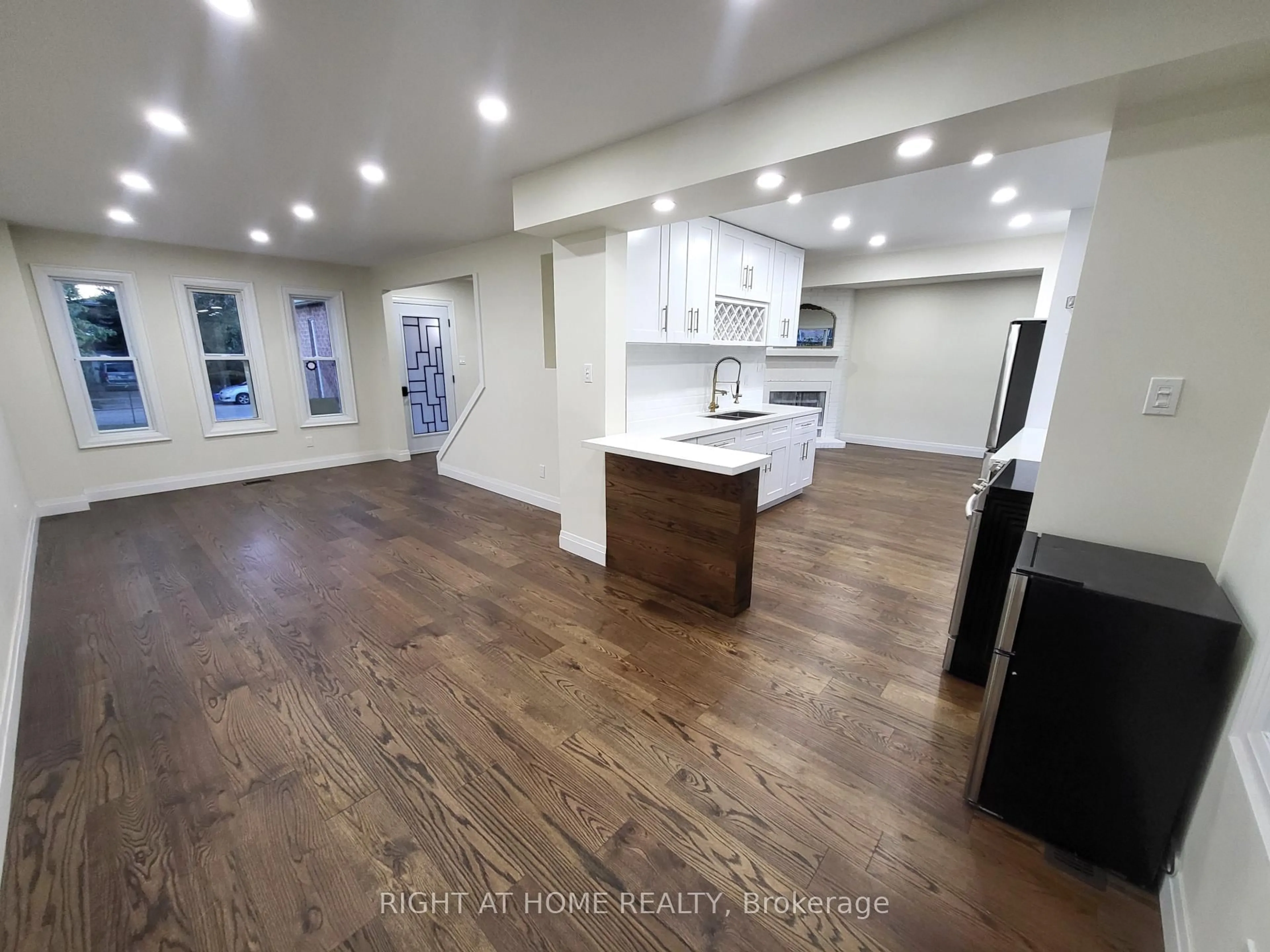 Open concept kitchen, wood/laminate floor for 247 Hickling Tr, Barrie Ontario L4M 5W9