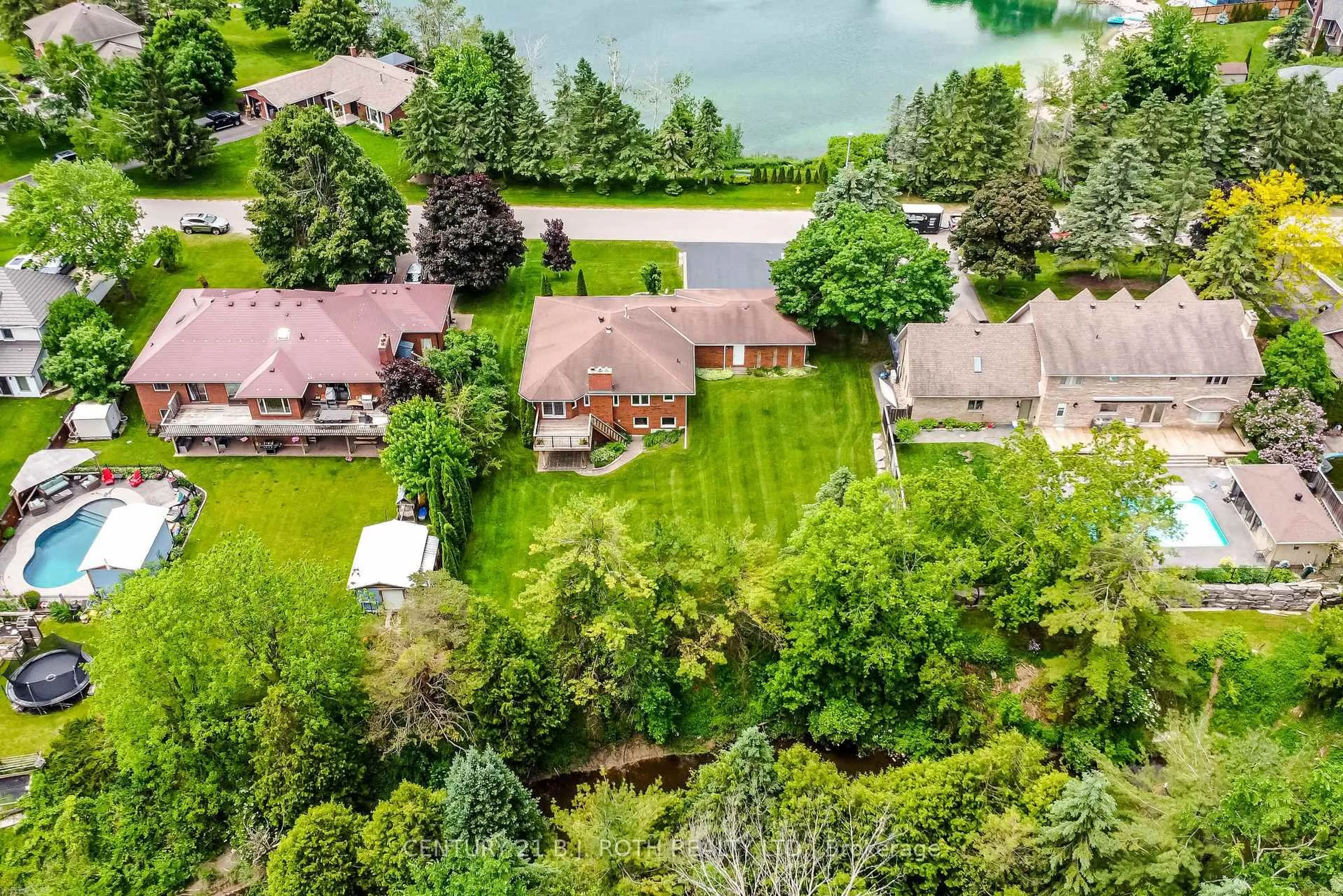 A pic from outside/outdoor area/front of a property/back of a property/a pic from drone, water/lake/river/ocean view for 34 Cairns Blvd, Springwater Ontario L9X 0N8