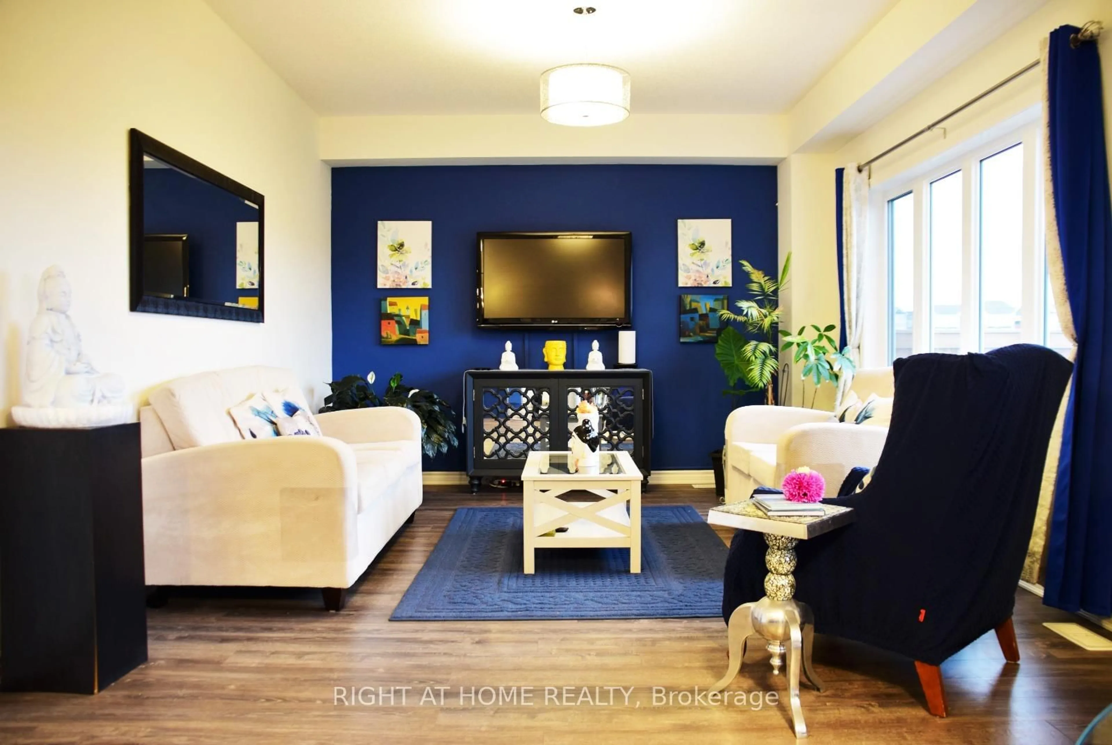 Living room with furniture, wood/laminate floor for 30 Sandhill Crane Dr, Wasaga Beach Ontario L9Z 0J6