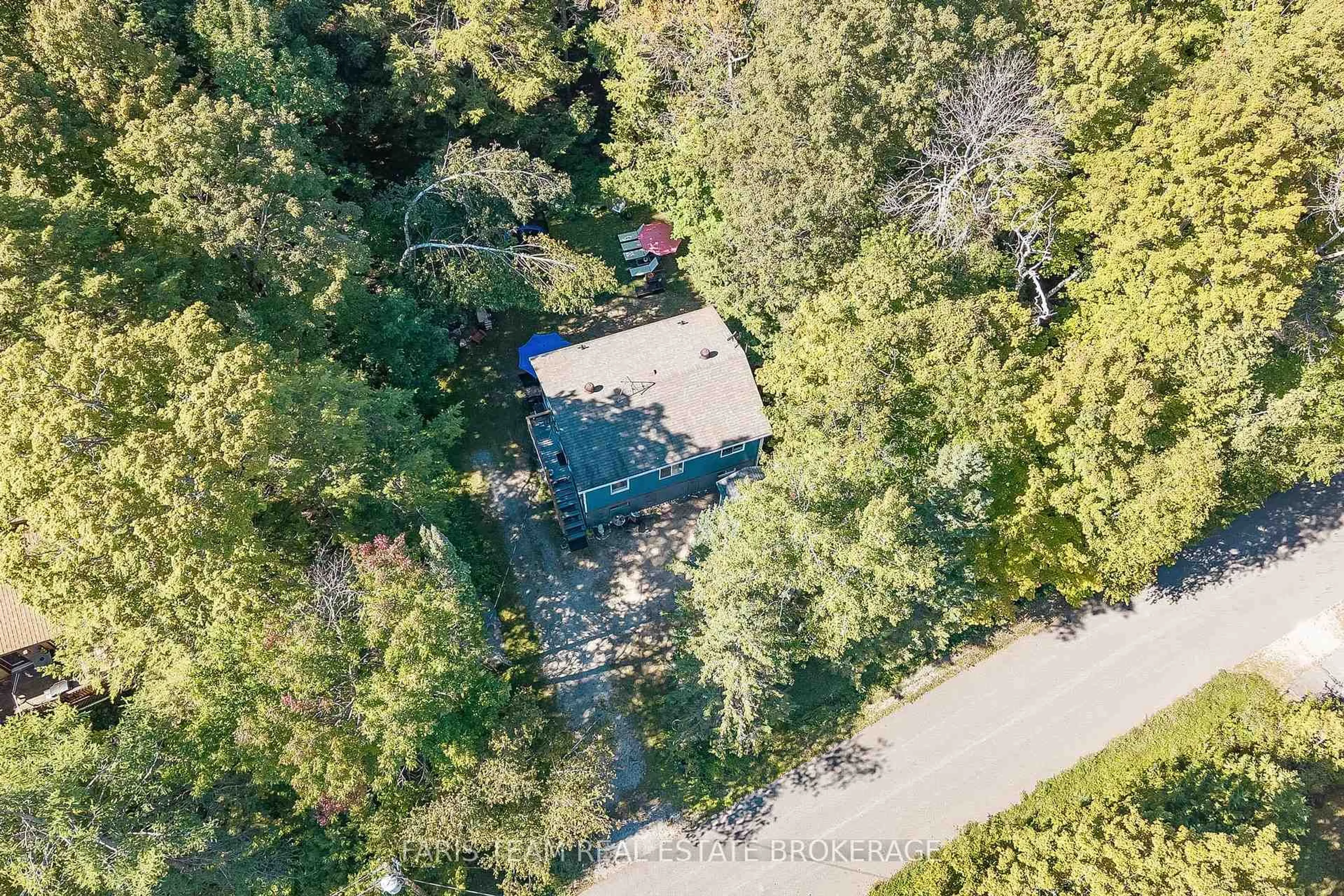 A pic from outside/outdoor area/front of a property/back of a property/a pic from drone, forest/trees view for 43 Manitou Cres, Tiny Ontario L9M 0C6