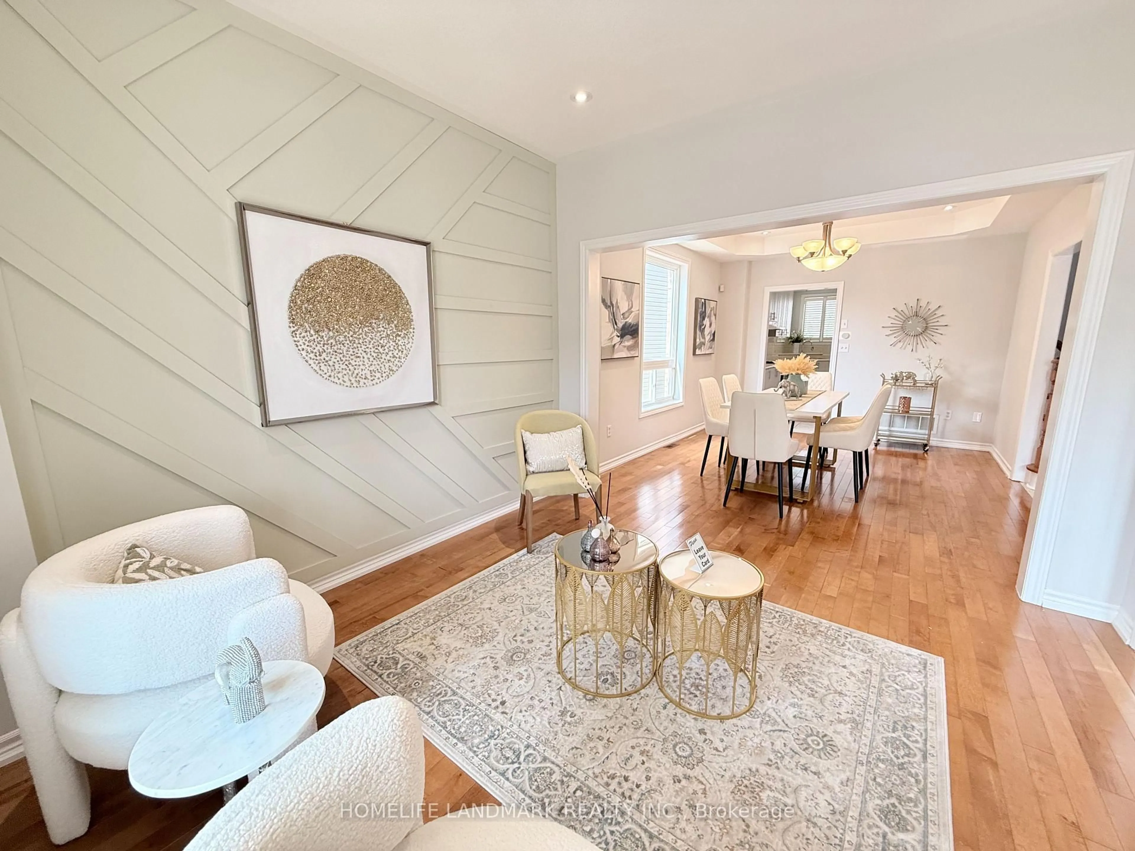 Living room with furniture, wood/laminate floor for 18 The Queensway, Barrie Ontario L4M 7H6