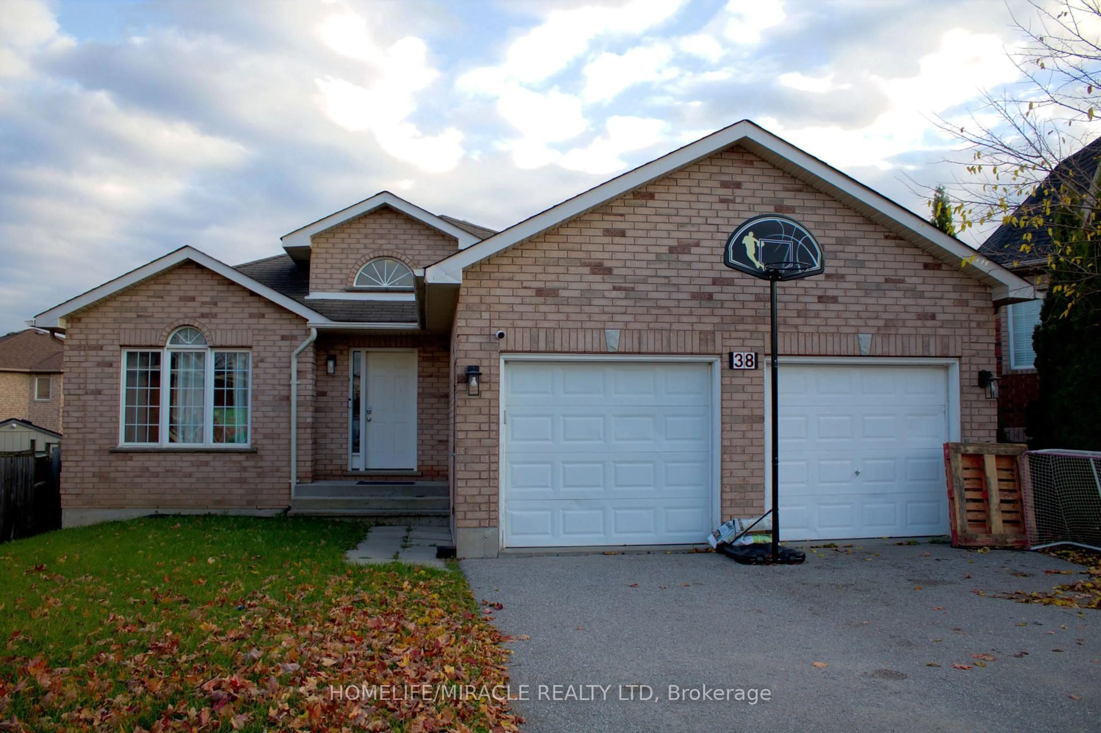 Home with brick exterior material, street for 38 Dunsmore Lane, Barrie Ontario L4M 7A1