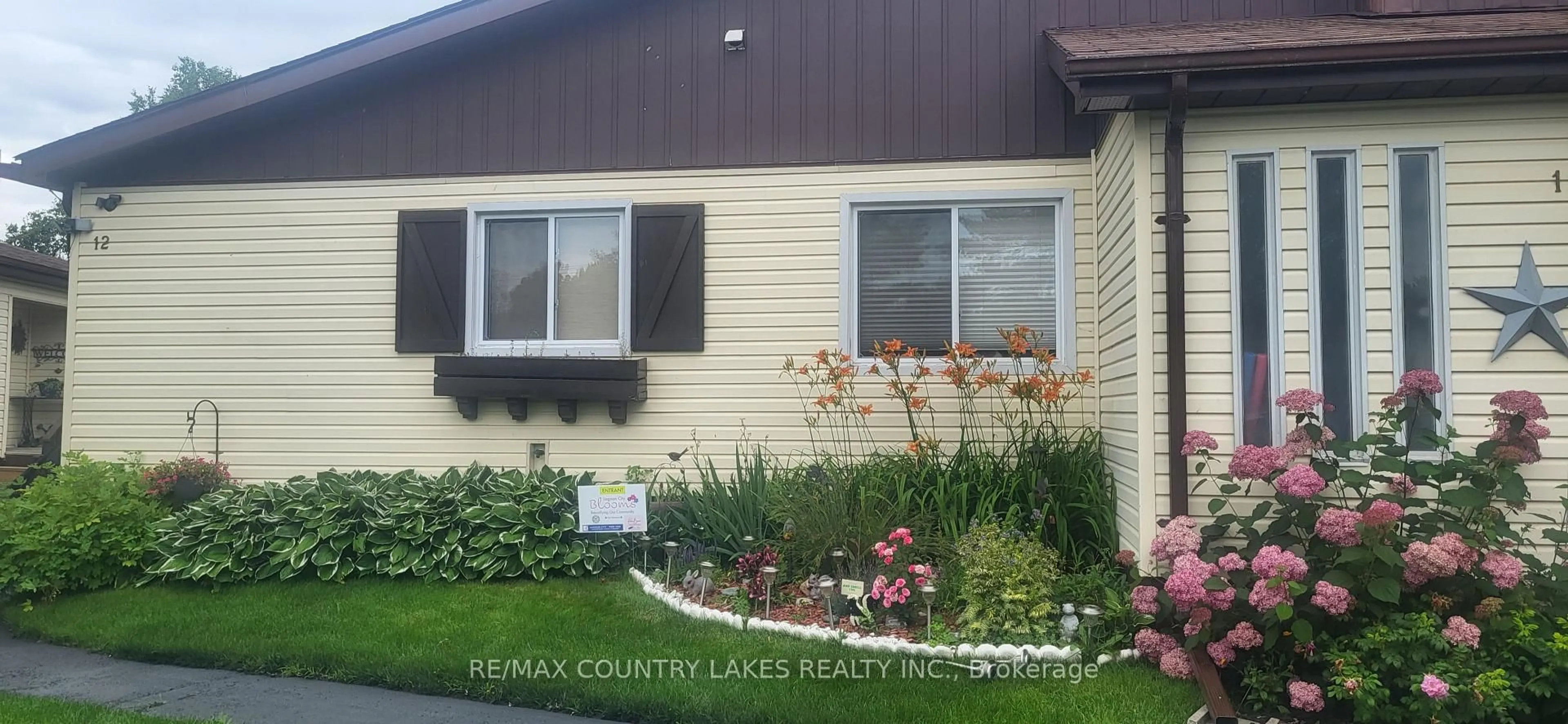 Home with vinyl exterior material, street for 70 Laguna Pkwy #12, Ramara Ontario L0K 1B0