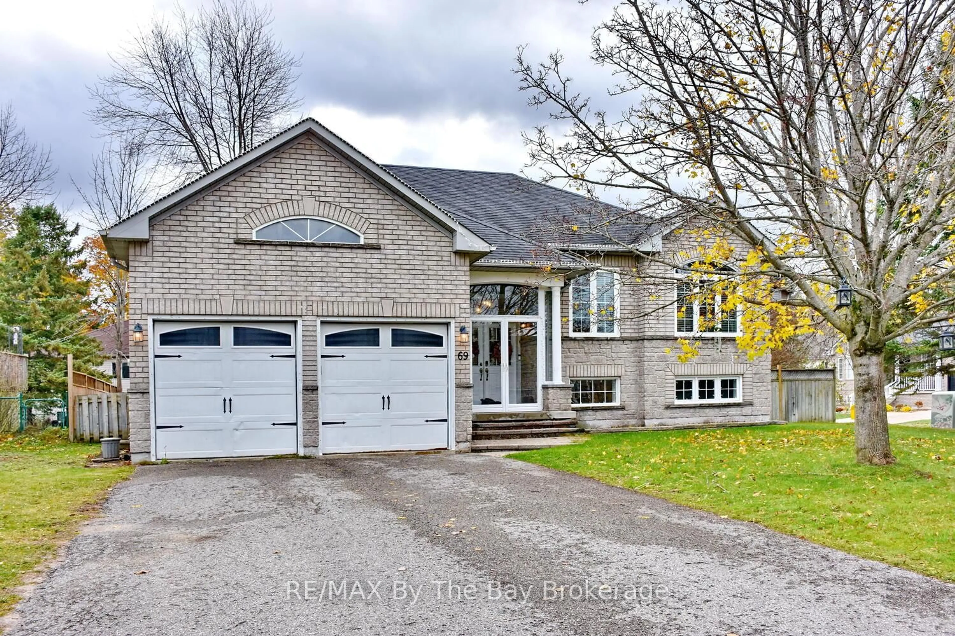 Home with brick exterior material, street for 69 Caribou Tr, Wasaga Beach Ontario L9Z 1N3