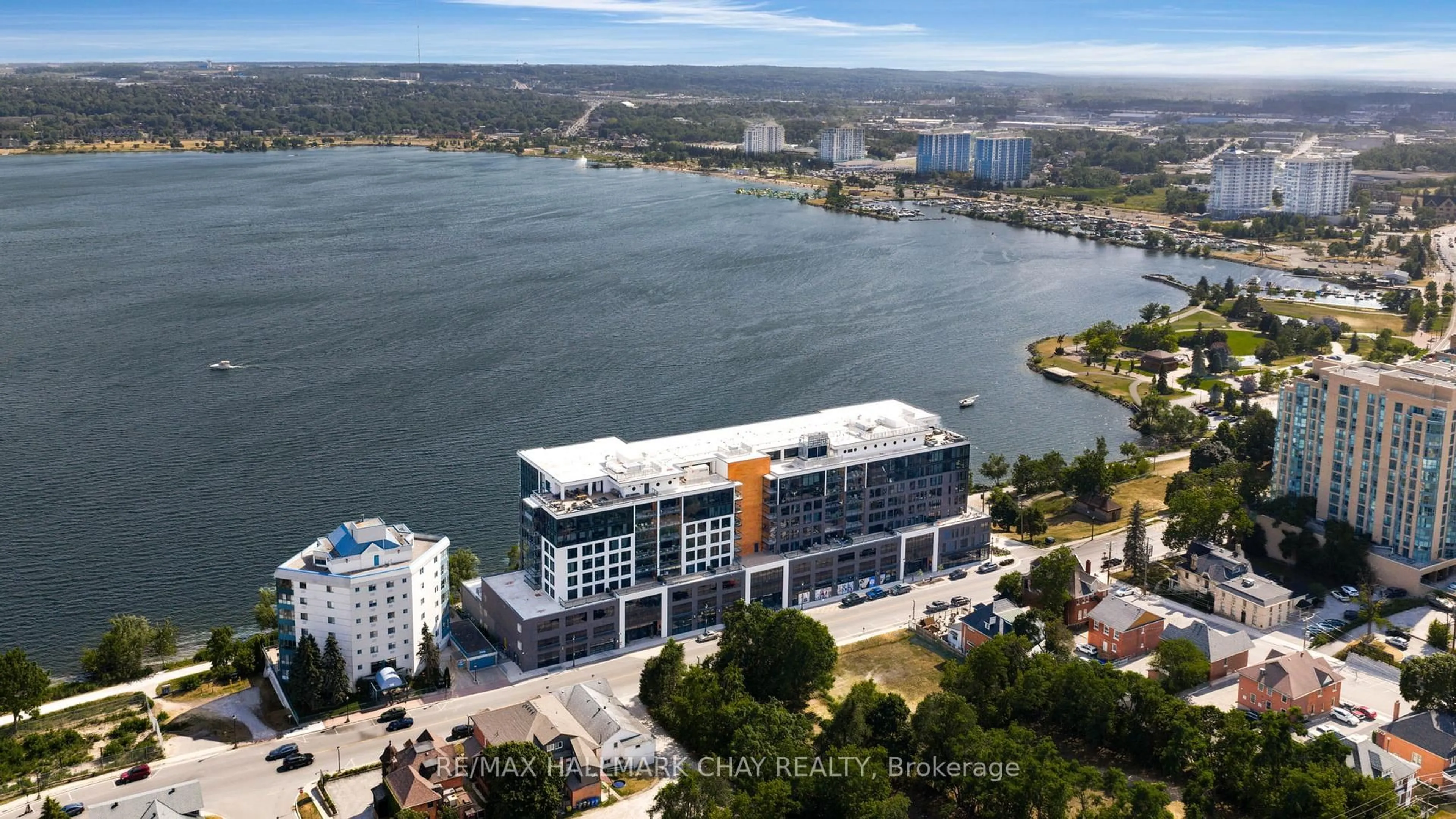 A pic from outside/outdoor area/front of a property/back of a property/a pic from drone, water/lake/river/ocean view for 185 Dunlop St #302, Barrie Ontario L4M 0L7