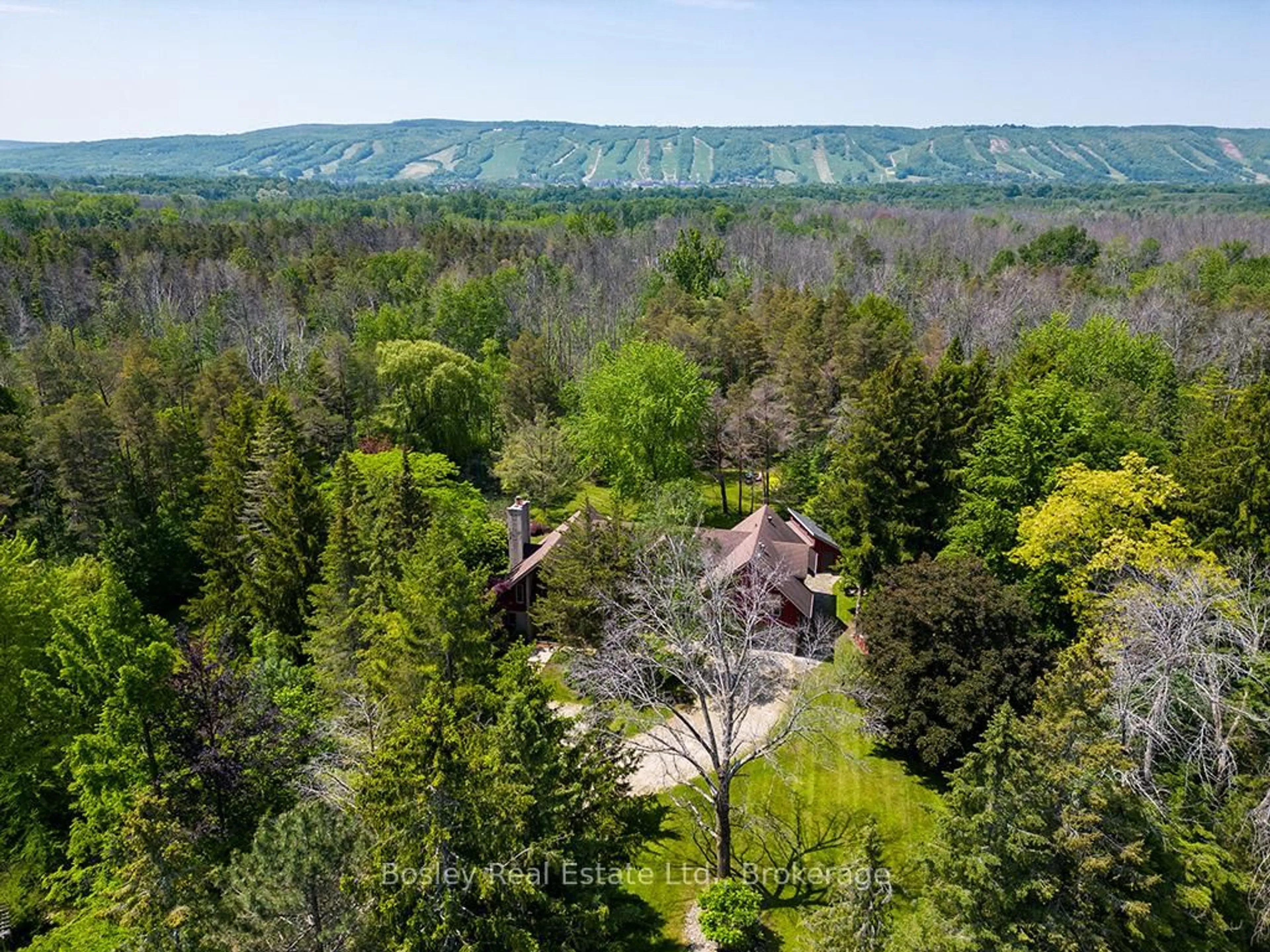 A pic from outside/outdoor area/front of a property/back of a property/a pic from drone, forest/trees view for 53 Silver Creek Dr, Collingwood Ontario L9Y 4W9