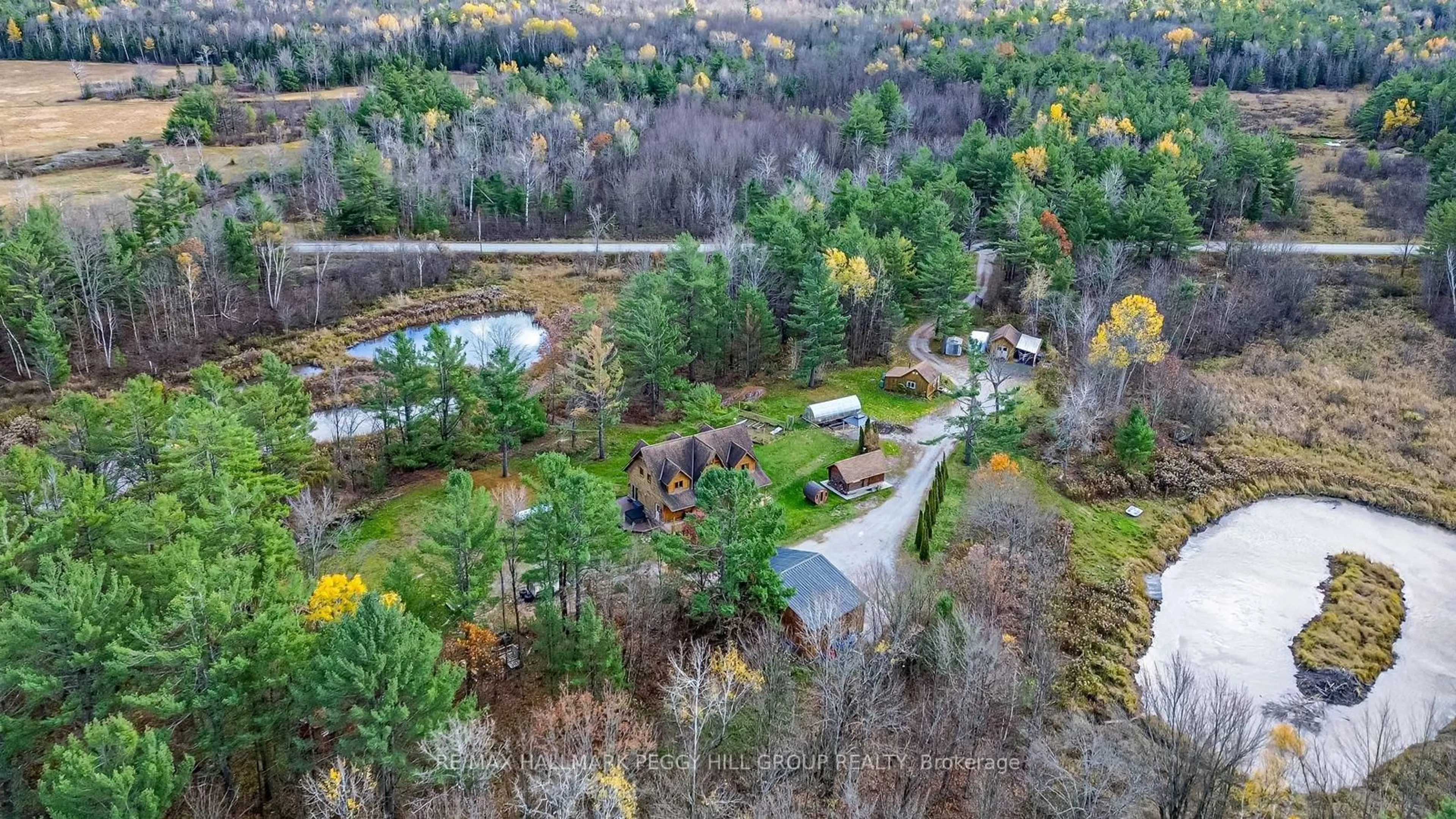 A pic from outside/outdoor area/front of a property/back of a property/a pic from drone, forest/trees view for 2504 Fairgrounds Rd, Ramara Ontario L0K 2B0