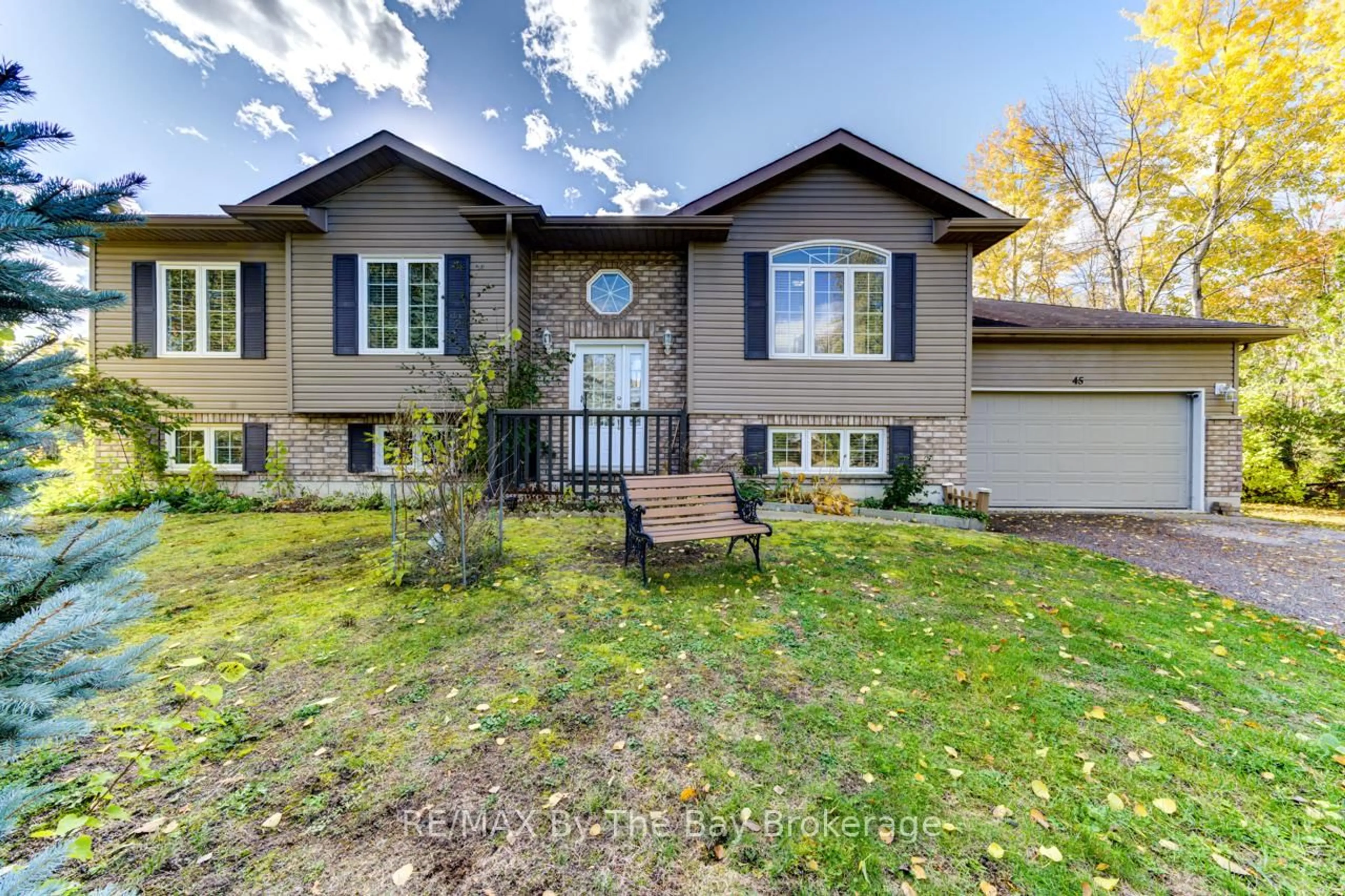 Home with brick exterior material, street for 45 William Ave, Wasaga Beach Ontario L9Z 2X3