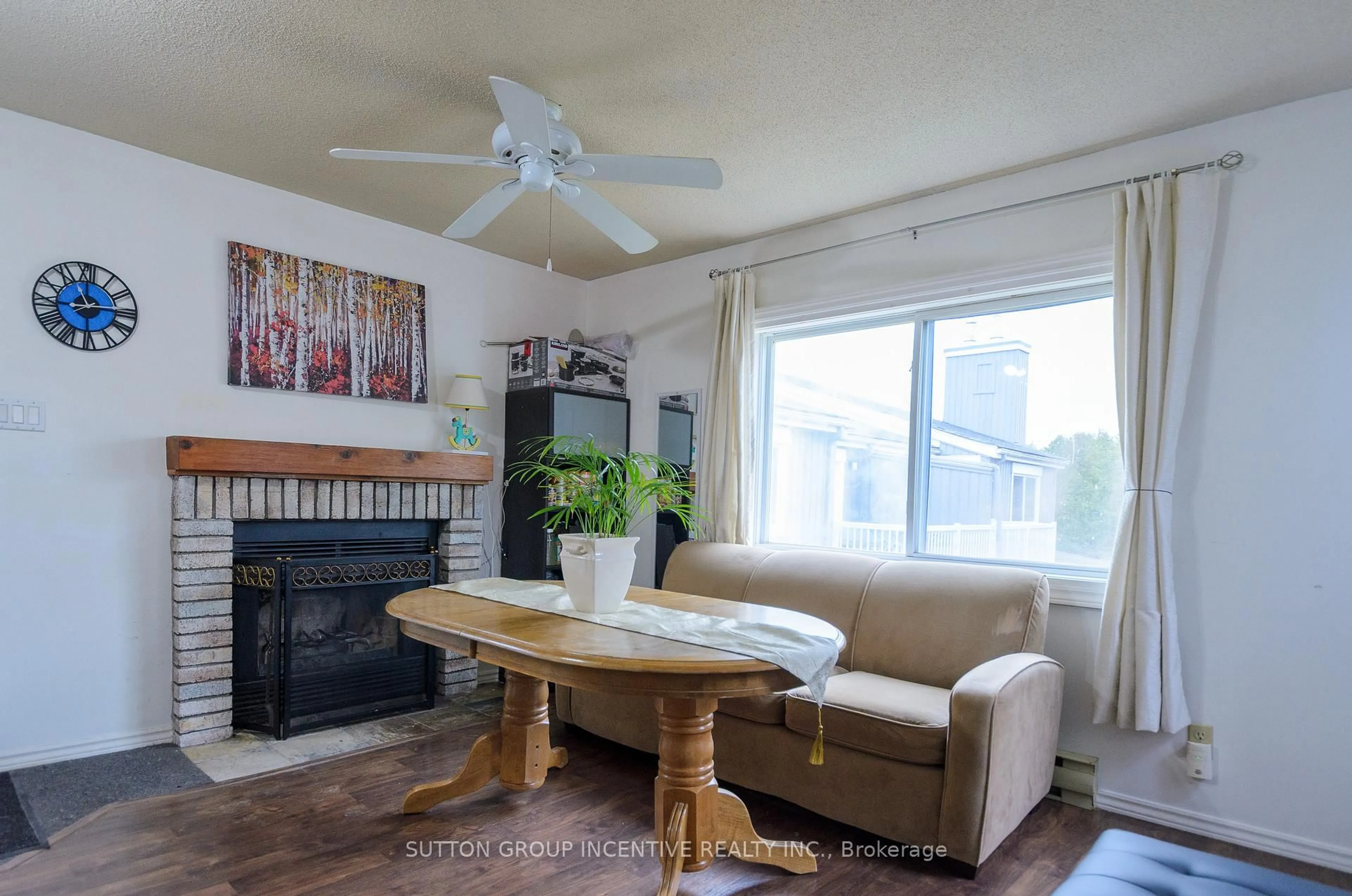 Living room with furniture, wood/laminate floor for 19 Dawson Dr #57, Collingwood Ontario L9Y 5B4