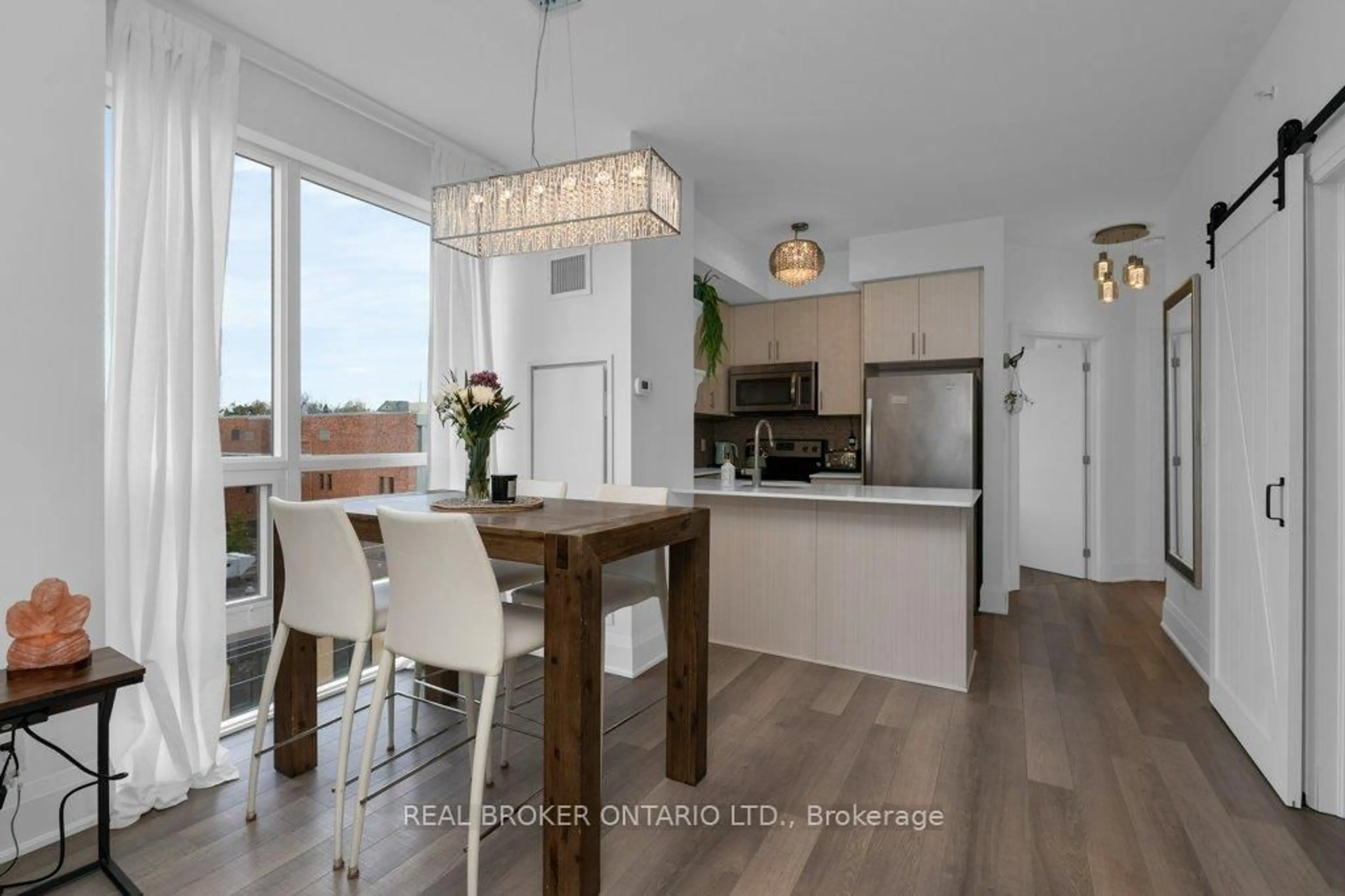 Open concept kitchen, wood/laminate floor for 111 Worsley St ##503, Barrie Ontario L4M 0J5