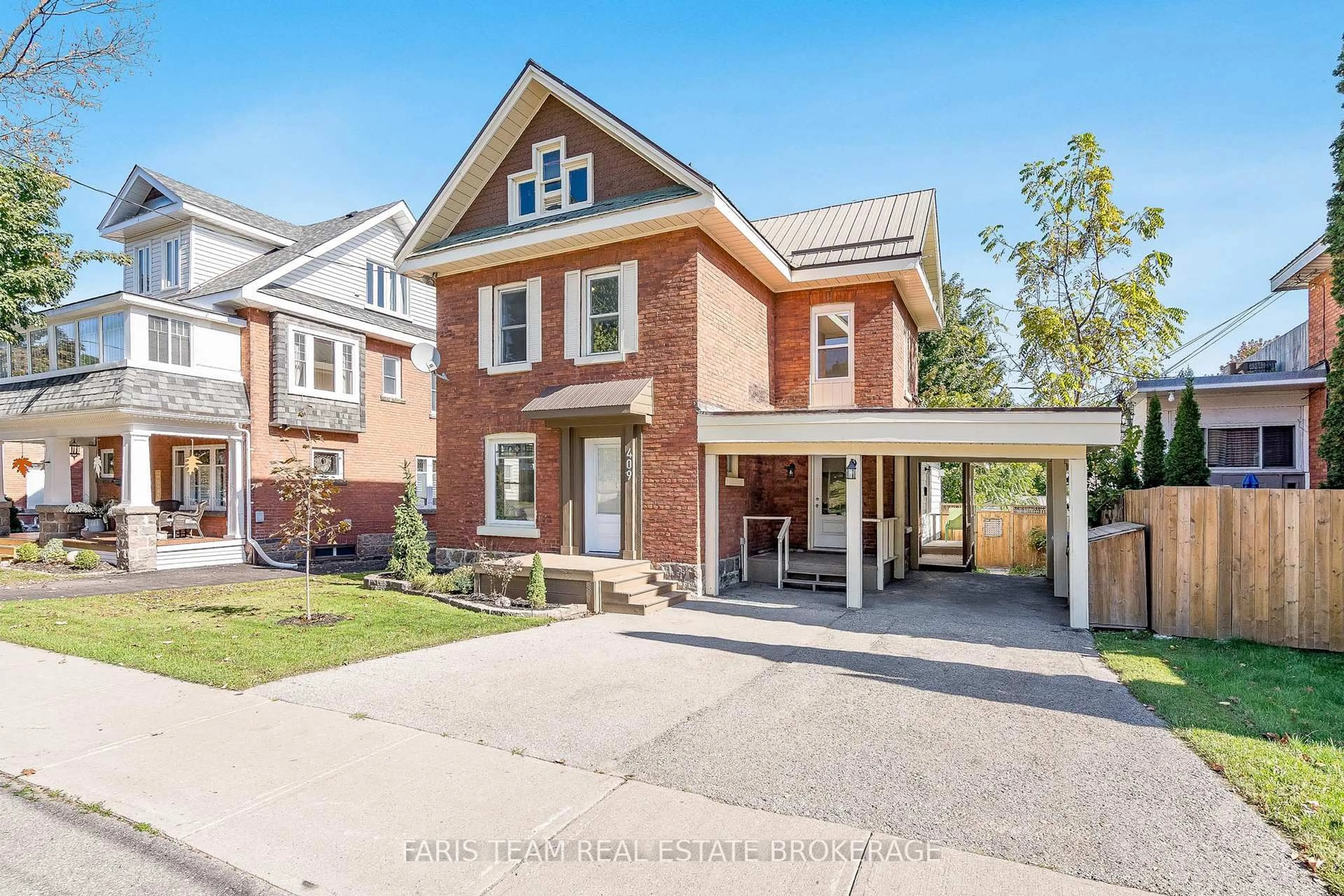 Home with brick exterior material, street for 409 Queen St, Midland Ontario L4R 3H9