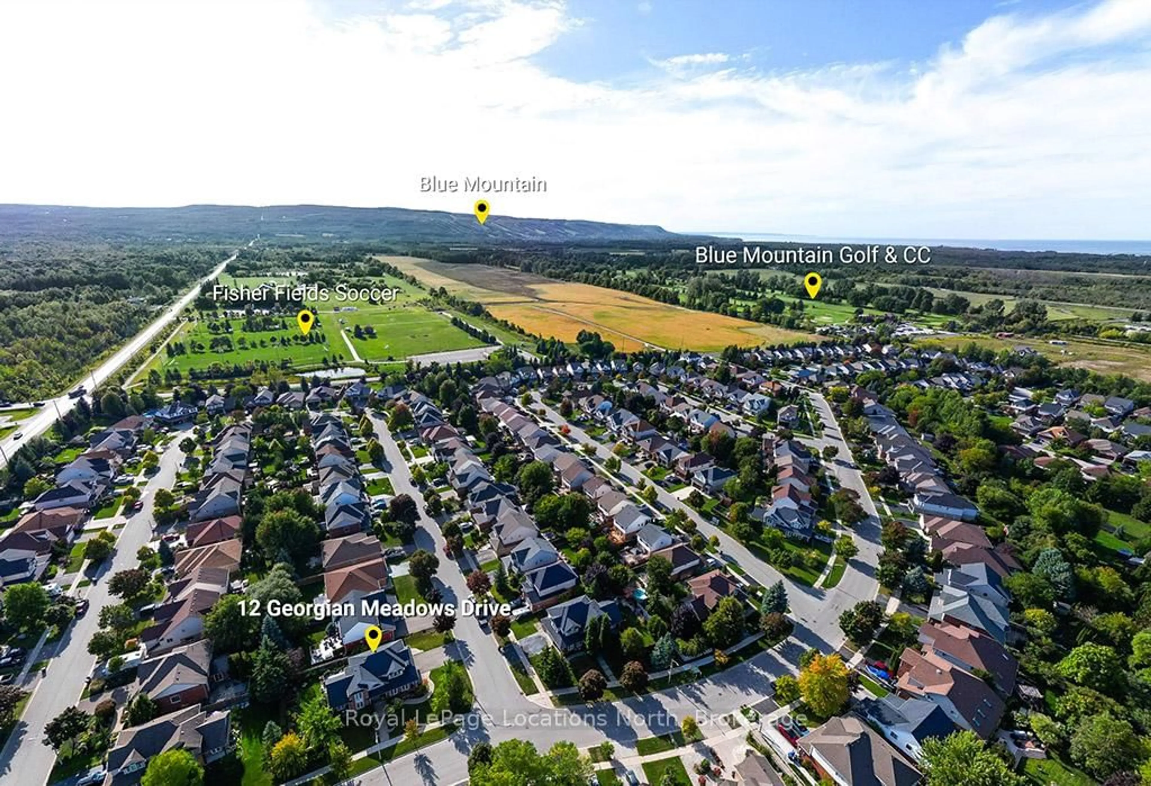 A pic from outside/outdoor area/front of a property/back of a property/a pic from drone, street for 12 Georgian Meadows Dr, Collingwood Ontario L9Y 5G9