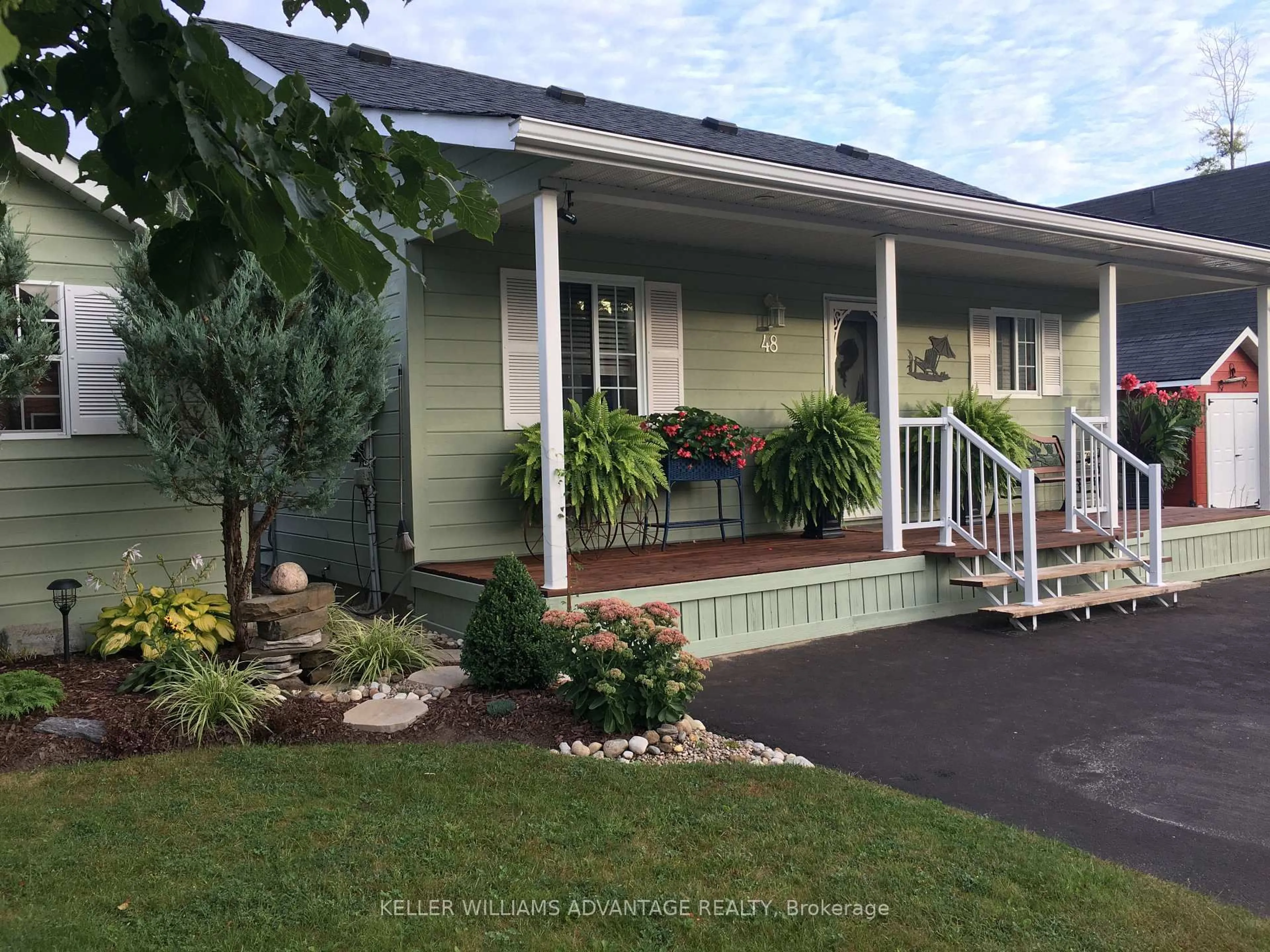 Home with vinyl exterior material, street for 48 Madawaska Tr, Wasaga Beach Ontario L9Z 1X7