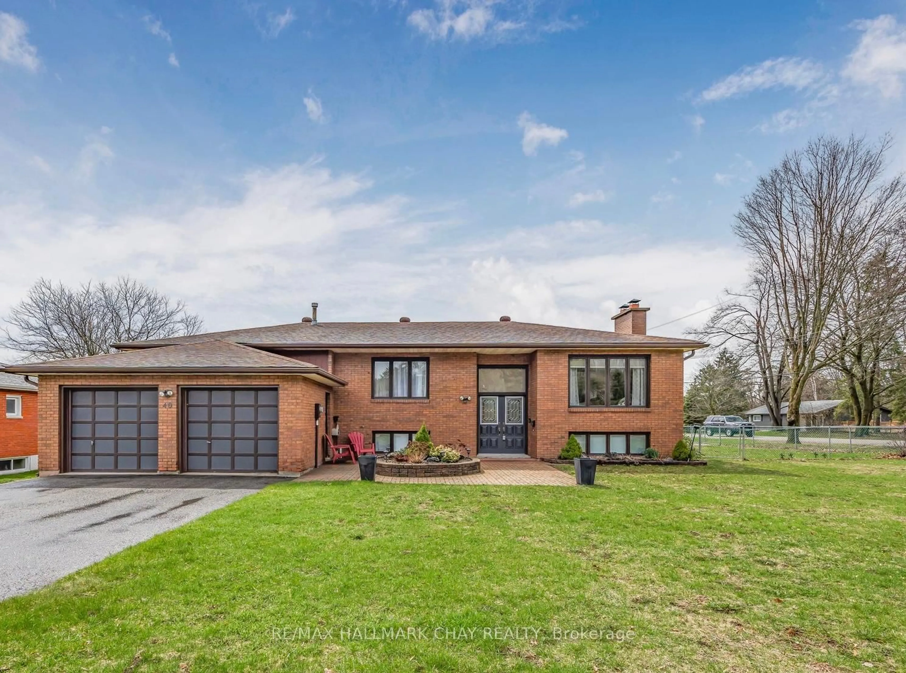 Home with brick exterior material, street for 40 Idlewood Dr, Springwater Ontario L9X 0P5